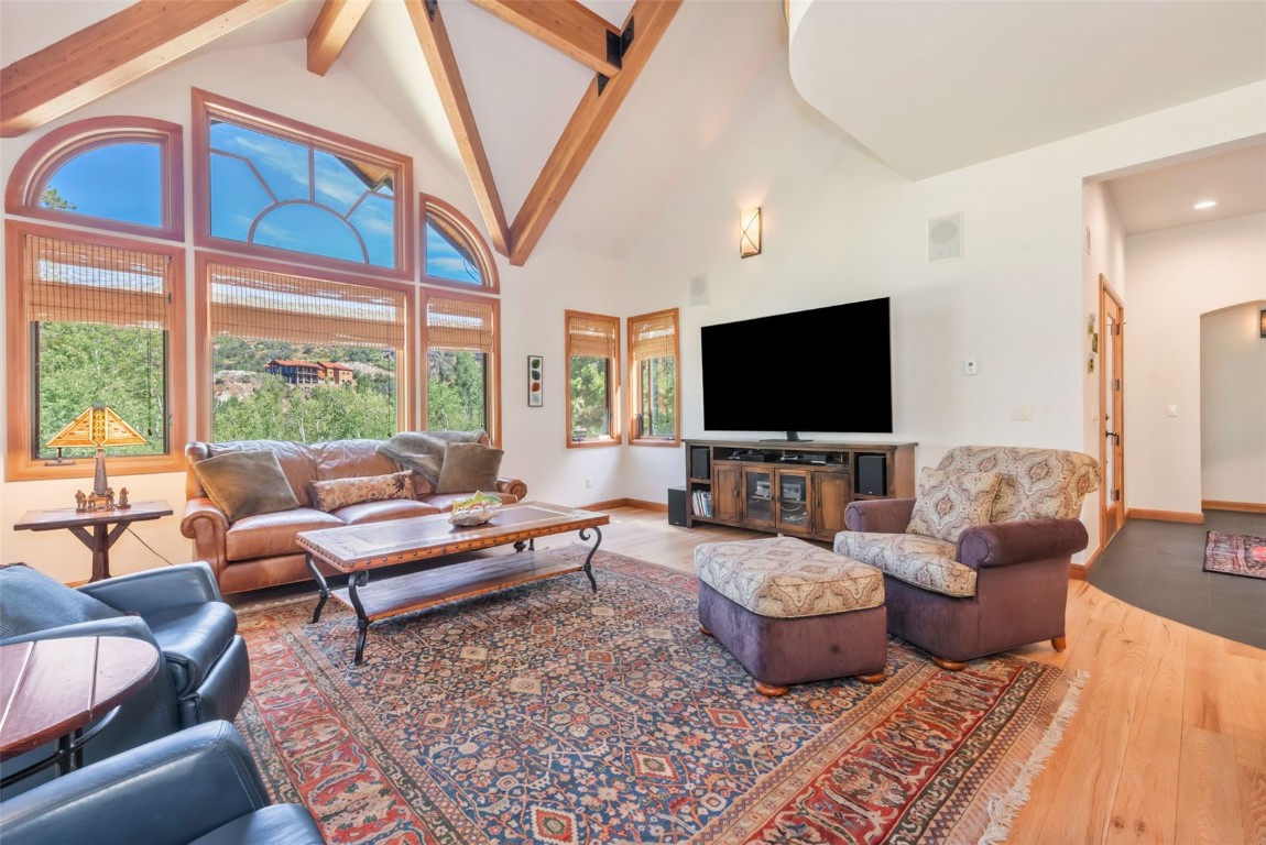 2911 Inverness Way Steamboat Springs, CO 80487 - Photo 10 of 43 a living room with furniture and a flat screen tv
