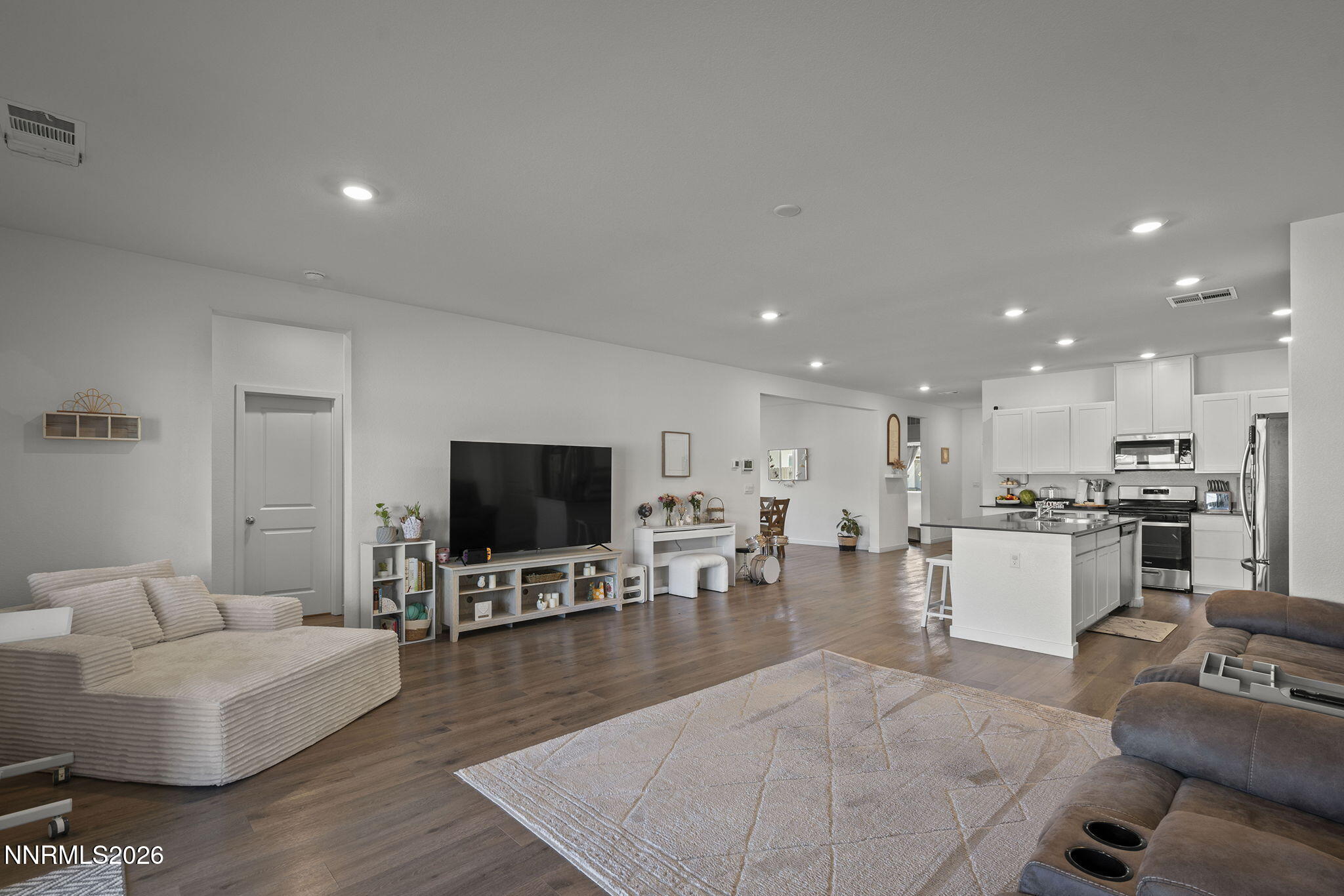 738 Butte Creek Road Dayton, NV 89403 - Photo 11 of 28 a living room with furniture and a flat screen tv