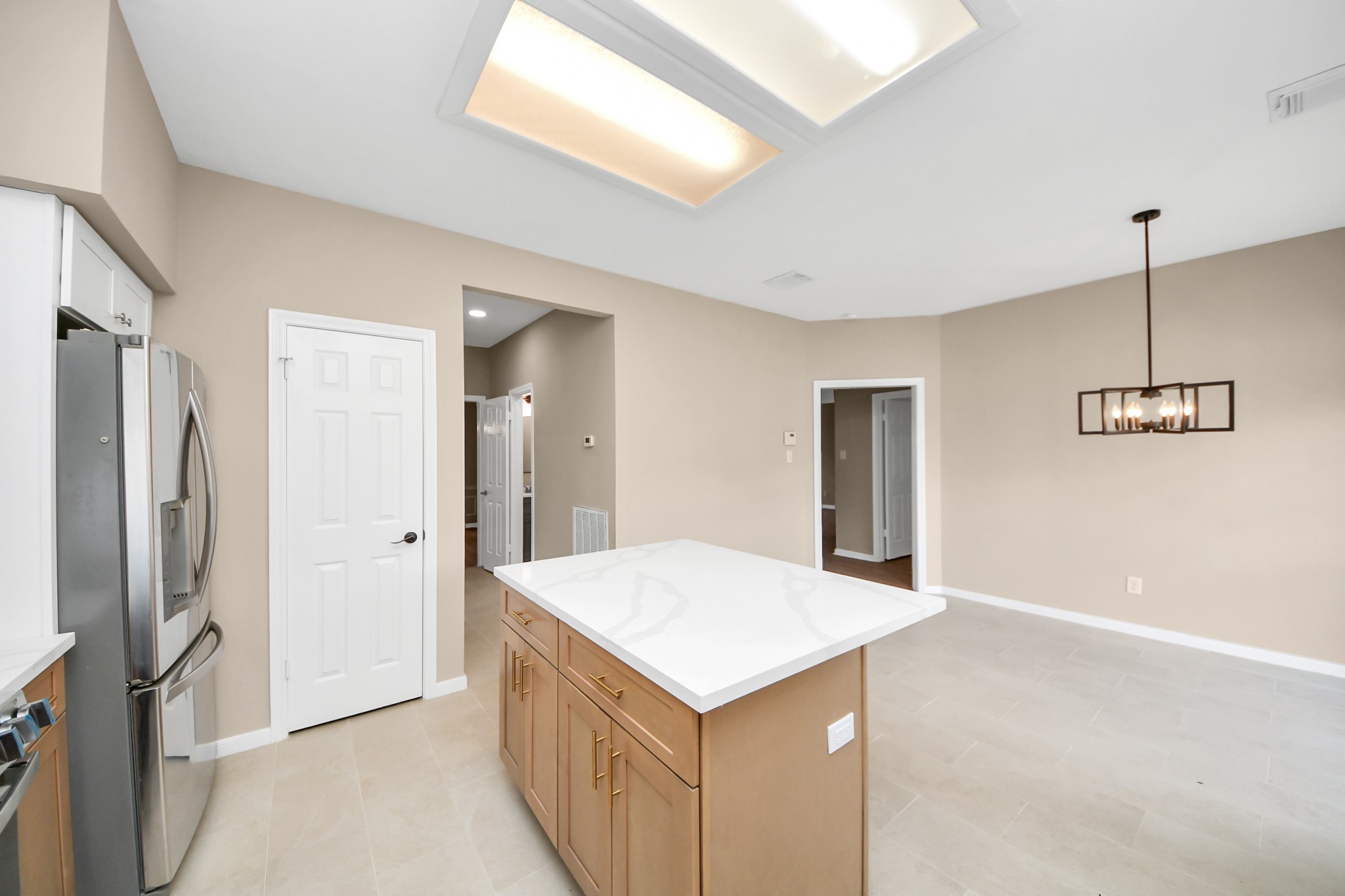 19030 Keyturn Lane Humble, TX 77346 - Photo 18 of 50 a kitchen with a refrigerator and countertop