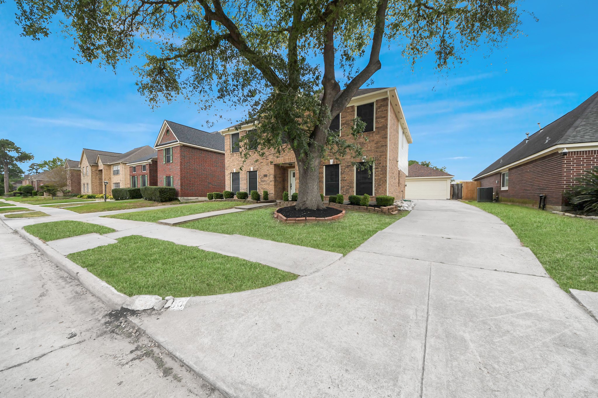 19030 Keyturn Lane Humble, TX 77346 - Photo 2 of 50 a front view of a house with a yard and trees