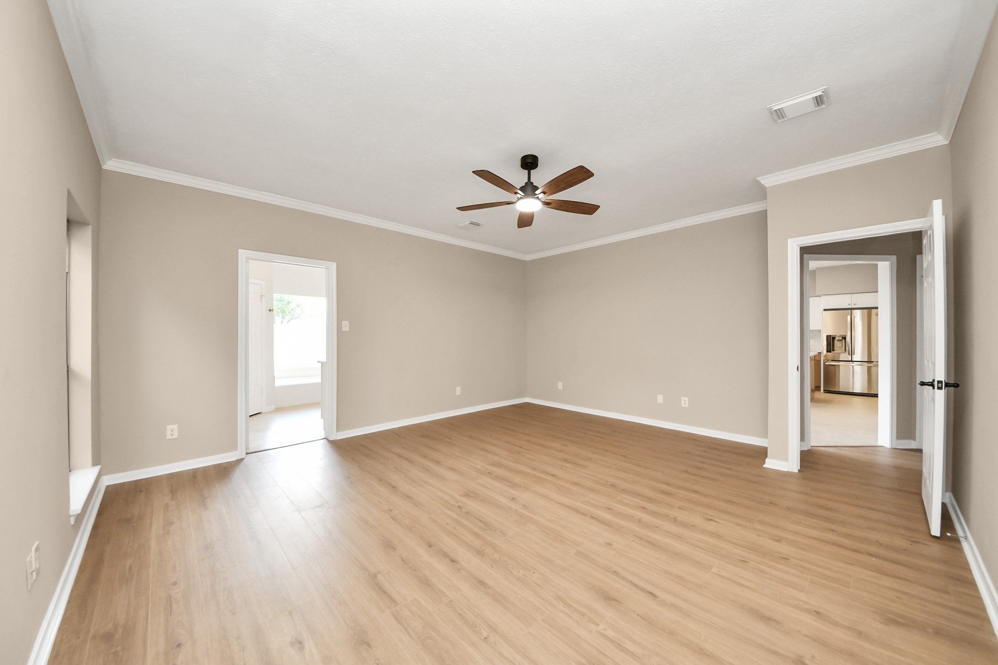 19030 Keyturn Lane Humble, TX 77346 - Photo 21 of 50 a view of an empty room with wooden floor