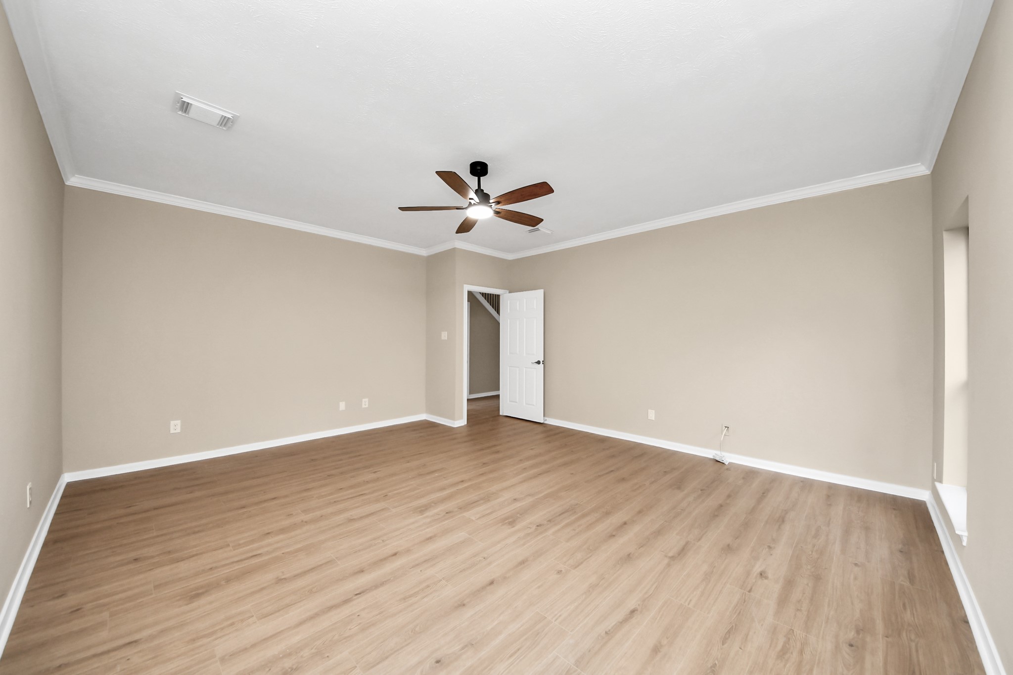 19030 Keyturn Lane Humble, TX 77346 - Photo 22 of 50 a view of an empty room with wooden floor