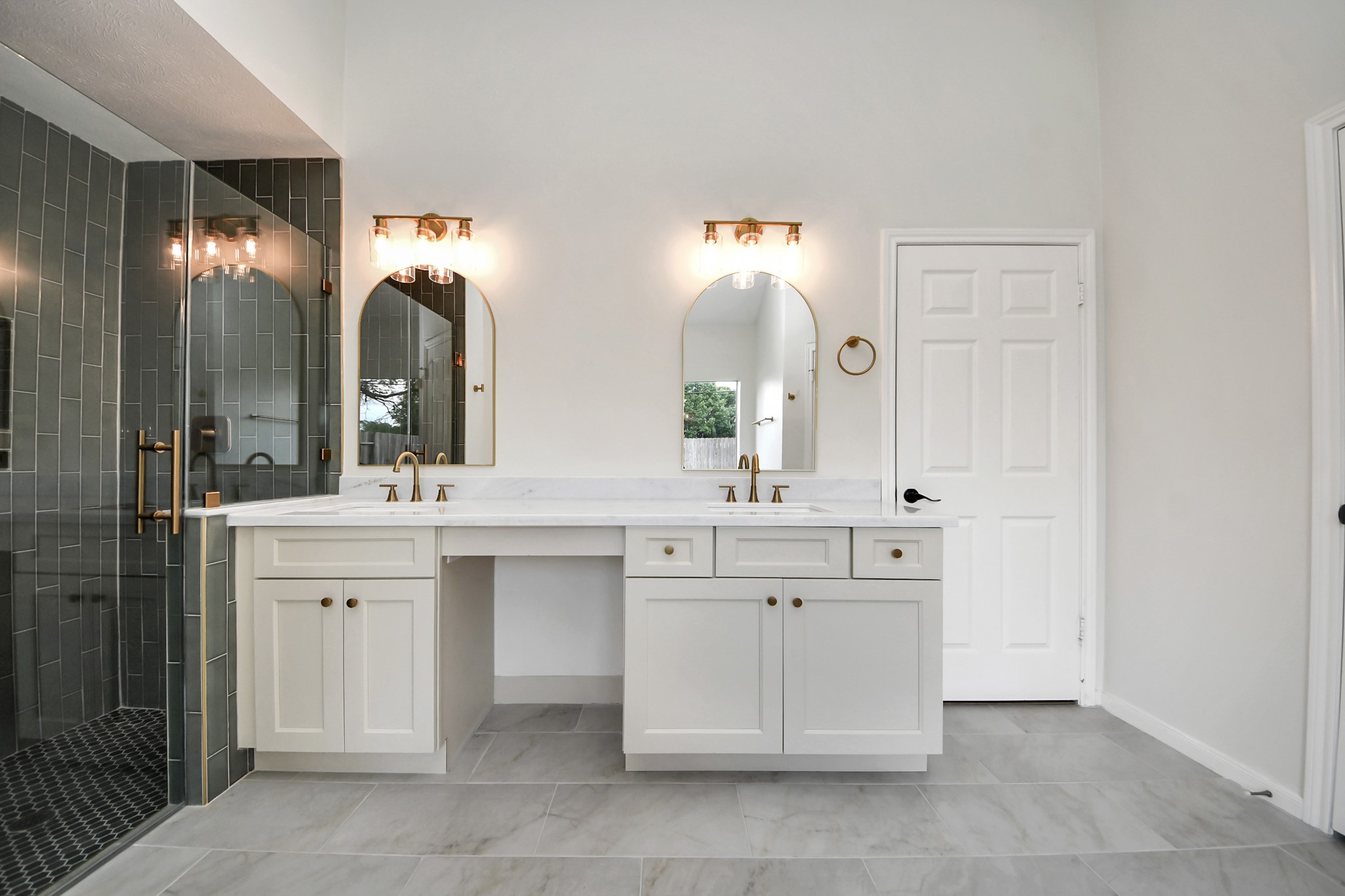 19030 Keyturn Lane Humble, TX 77346 - Photo 26 of 50 a spacious bathroom with a double vanity sink mirror and double