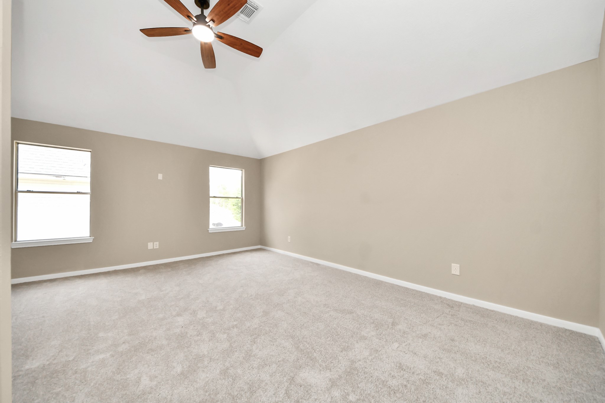 19030 Keyturn Lane Humble, TX 77346 - Photo 34 of 50 an empty room with windows and fan