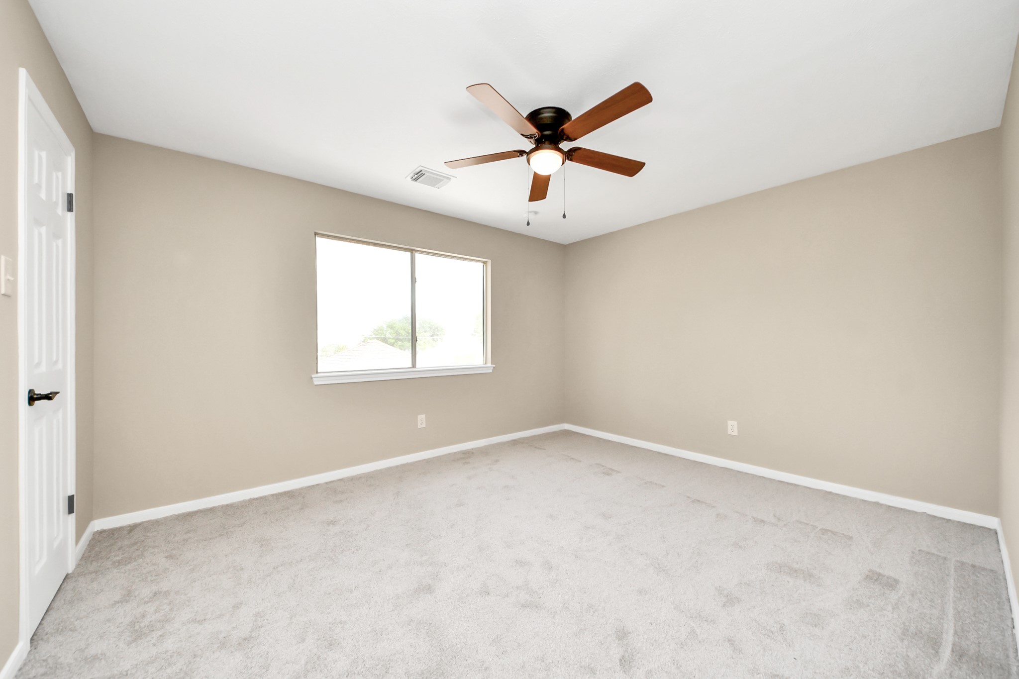 19030 Keyturn Lane Humble, TX 77346 - Photo 35 of 50 a view of an empty room with a window