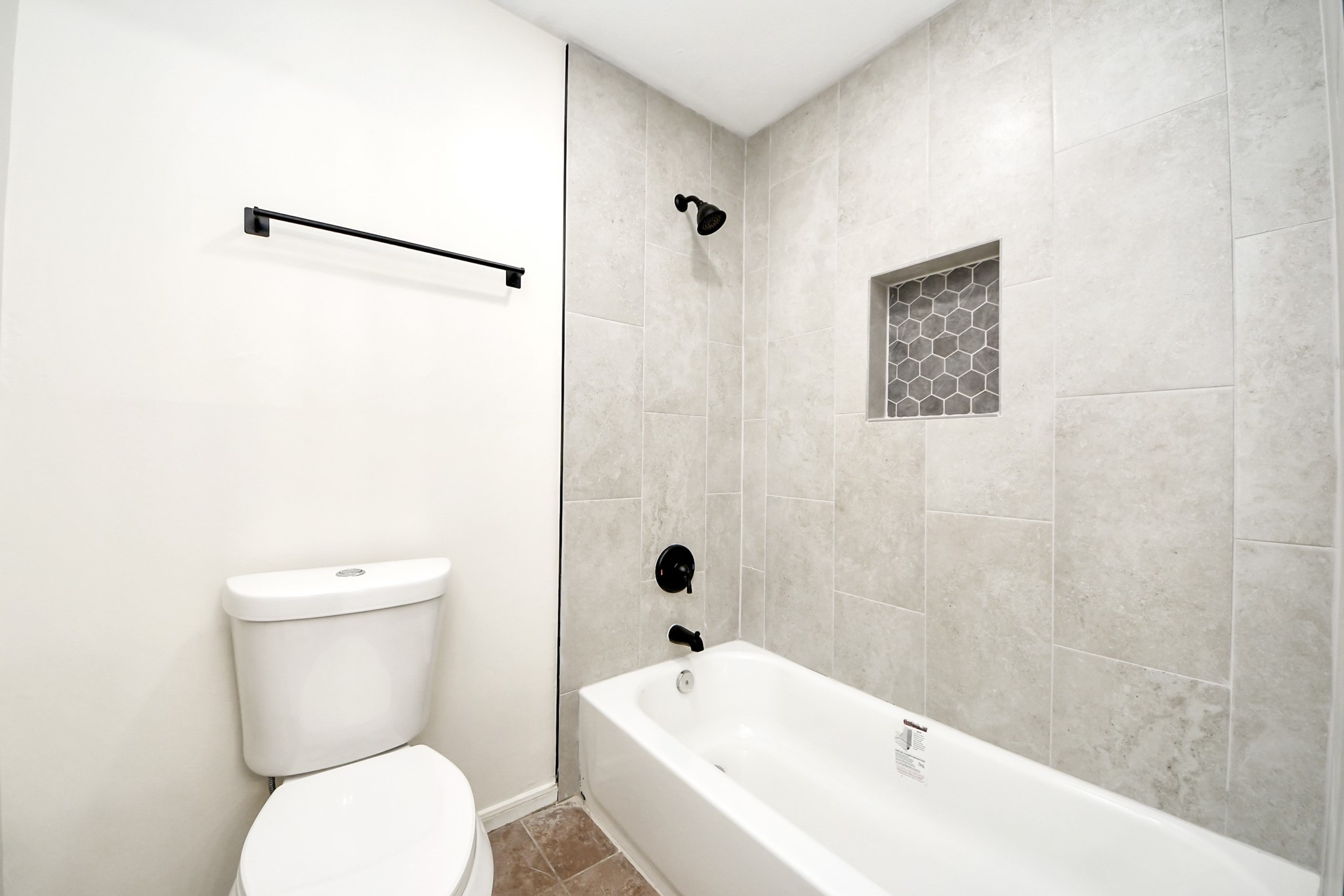 19030 Keyturn Lane Humble, TX 77346 - Photo 40 of 50 a white toilet sitting next to a white bath tub