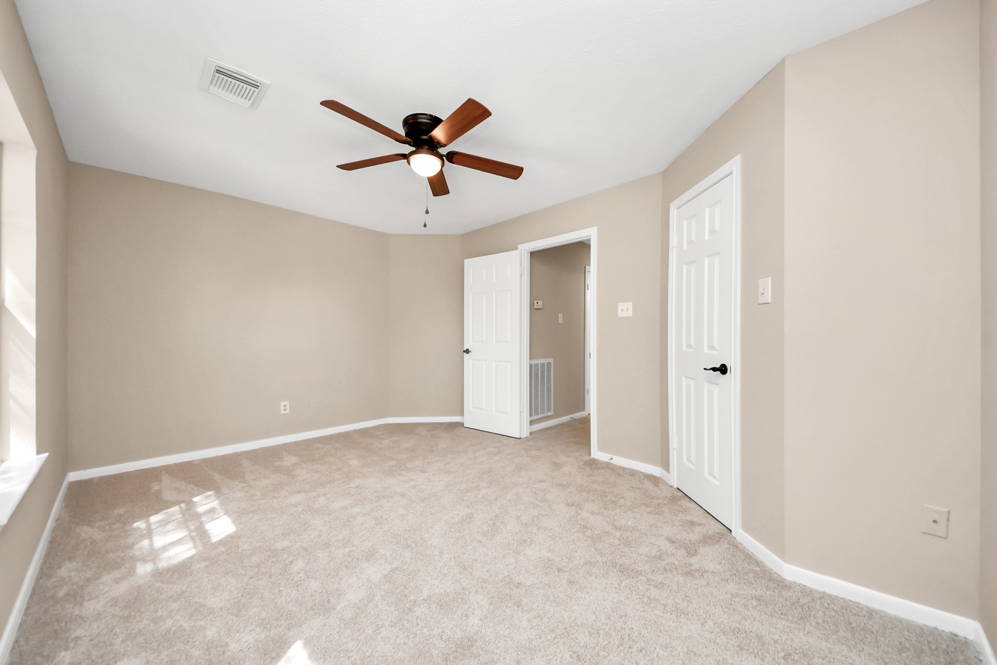 19030 Keyturn Lane Humble, TX 77346 - Photo 43 of 50 a view of room with a ceiling fan and window