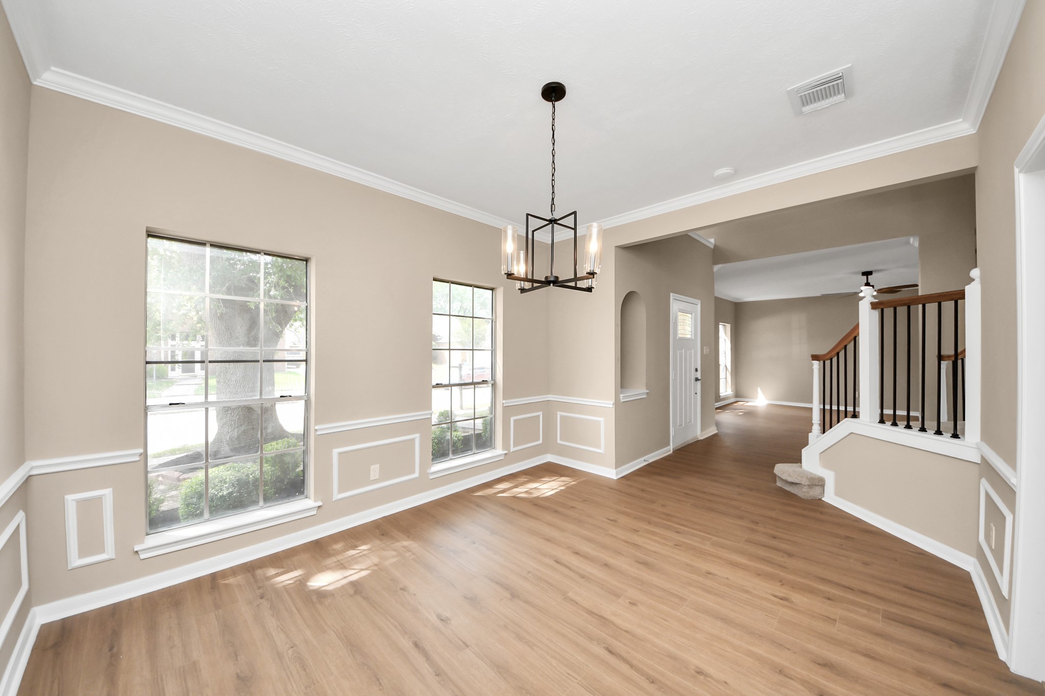 19030 Keyturn Lane Humble, TX 77346 - Photo 8 of 50 a view of an empty room with a window and wooden floor