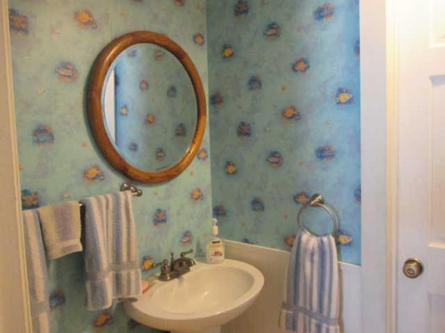 3280 Bethel Road Pulaski, TN 38478 - Photo 11 of 20 a bathroom with a sink a mirror and a shower curtain