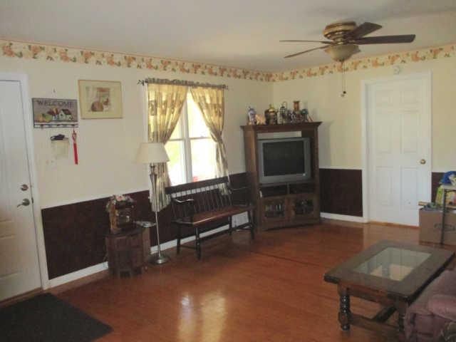 3280 Bethel Road Pulaski, TN 38478 - Photo 3 of 20 a living room with furniture a window and a fireplace