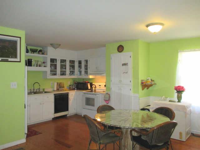 3280 Bethel Road Pulaski, TN 38478 - Photo 5 of 20 a kitchen with cabinets and wooden floor