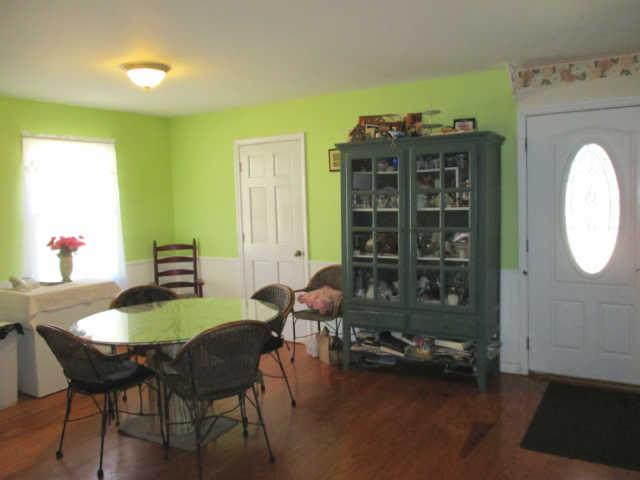 3280 Bethel Road Pulaski, TN 38478 - Photo 6 of 20 a dining room with furniture and a chandelier