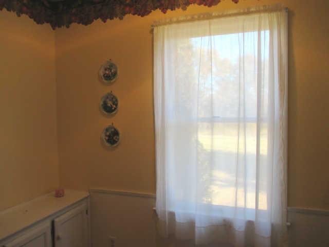 3280 Bethel Road Pulaski, TN 38478 - Photo 7 of 20 a bathroom with a glass shower door