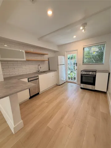 a view of livingroom with furniture and staircase