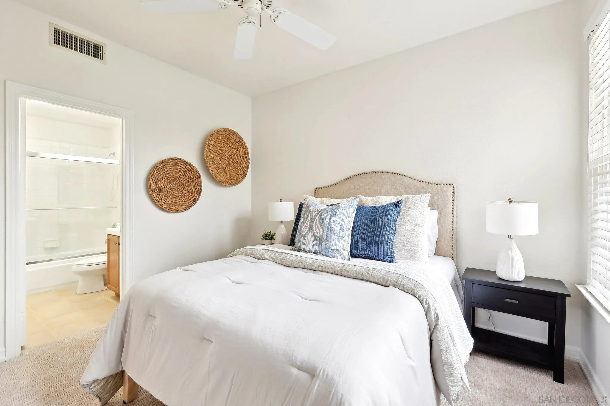 11781 Treadwell Drive Poway, CA 92064 - Photo 26 of 63 a bedroom with a bed and a chandelier