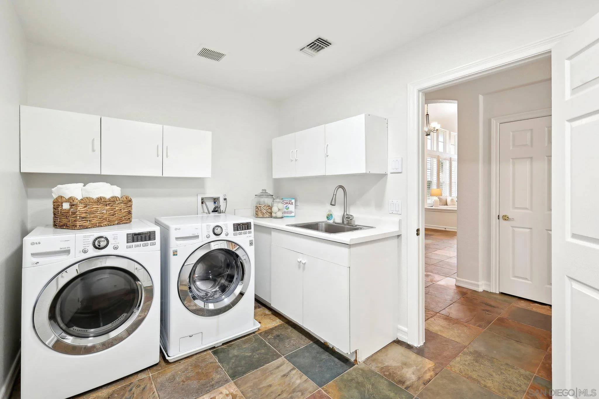 11781 Treadwell Drive Poway, CA 92064 - Photo 29 of 63 a utility room with sink dryer and washer