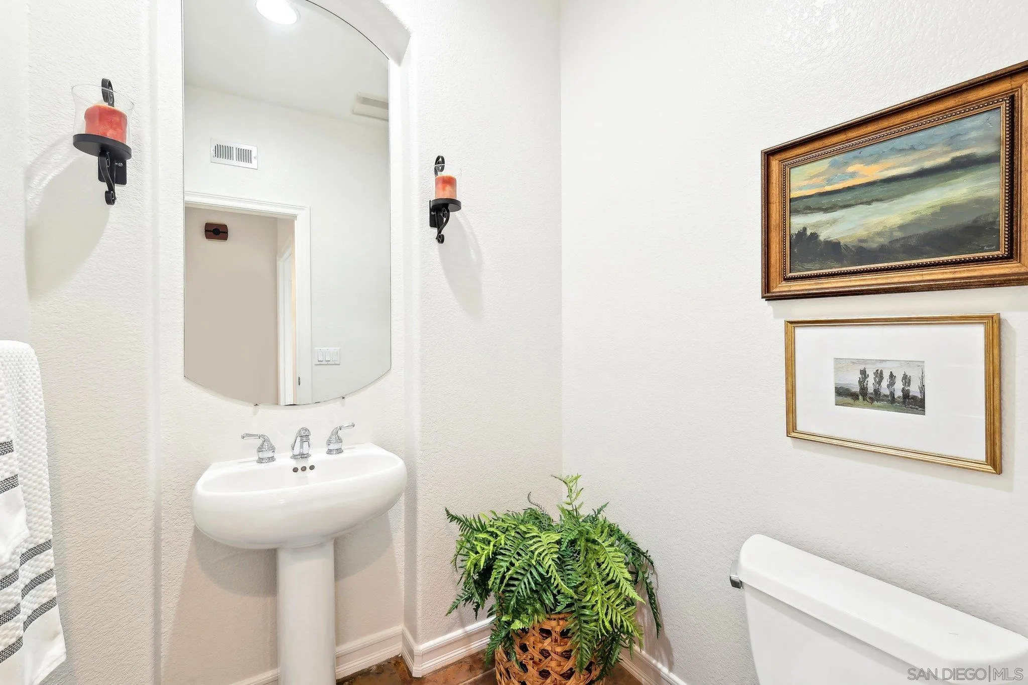 11781 Treadwell Drive Poway, CA 92064 - Photo 30 of 63 a bathroom with a sink mirror and toilet