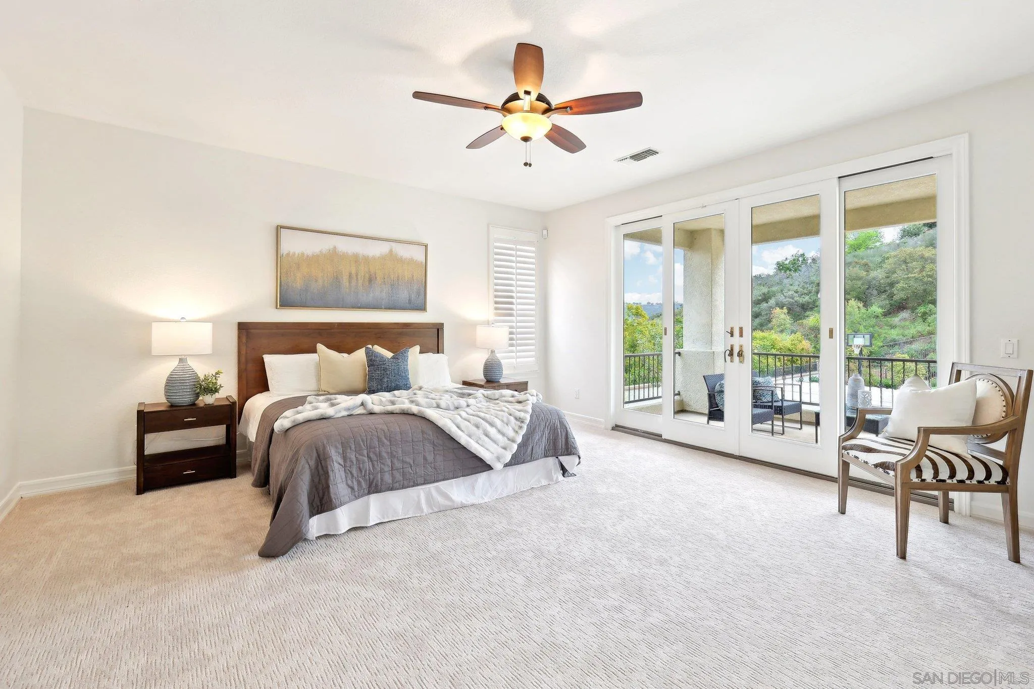 11781 Treadwell Drive Poway, CA 92064 - Photo 32 of 63 a spacious bedroom with a bed and a large window