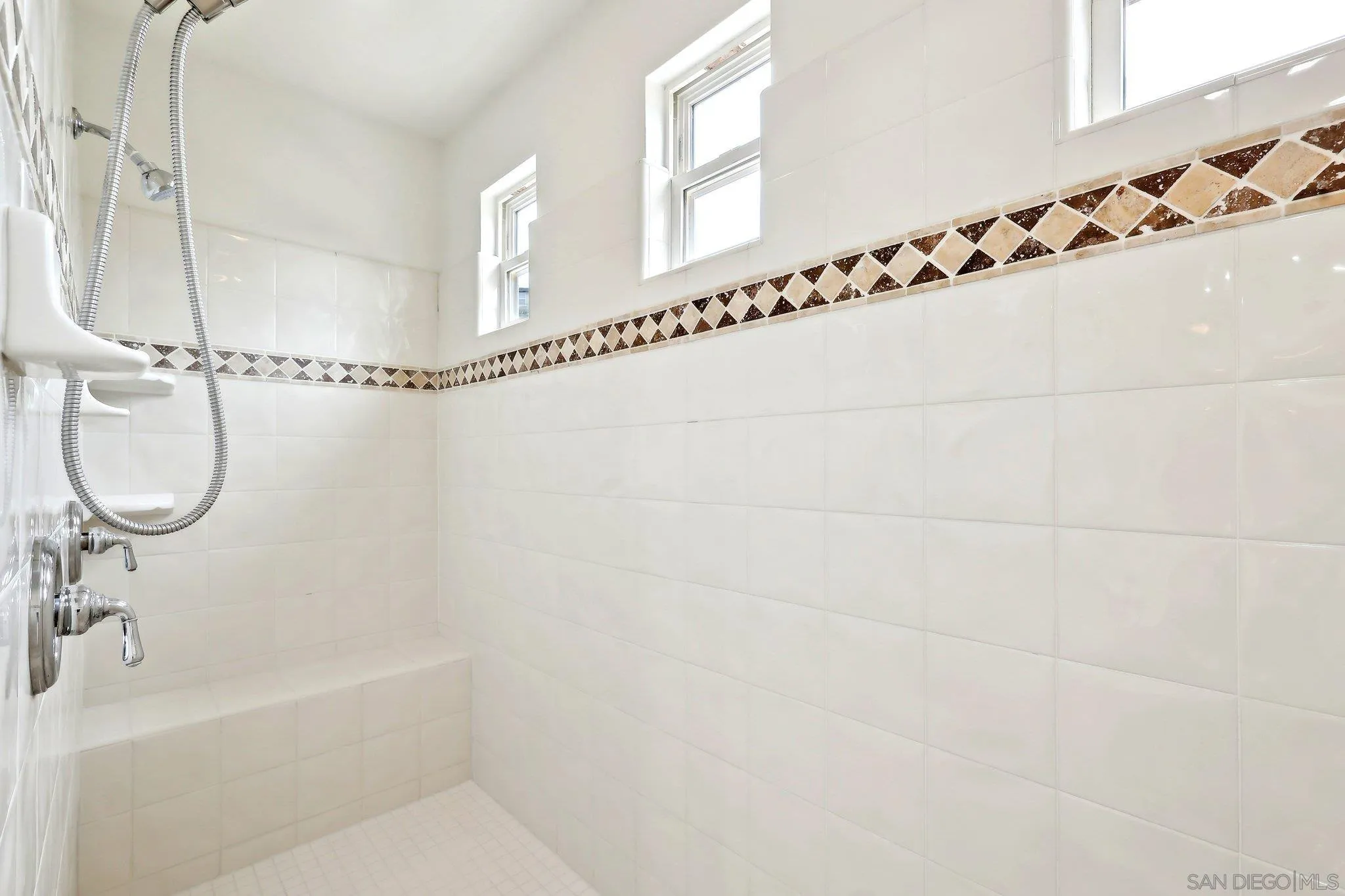 11781 Treadwell Drive Poway, CA 92064 - Photo 38 of 63 a bathroom with a bathtub and a shower