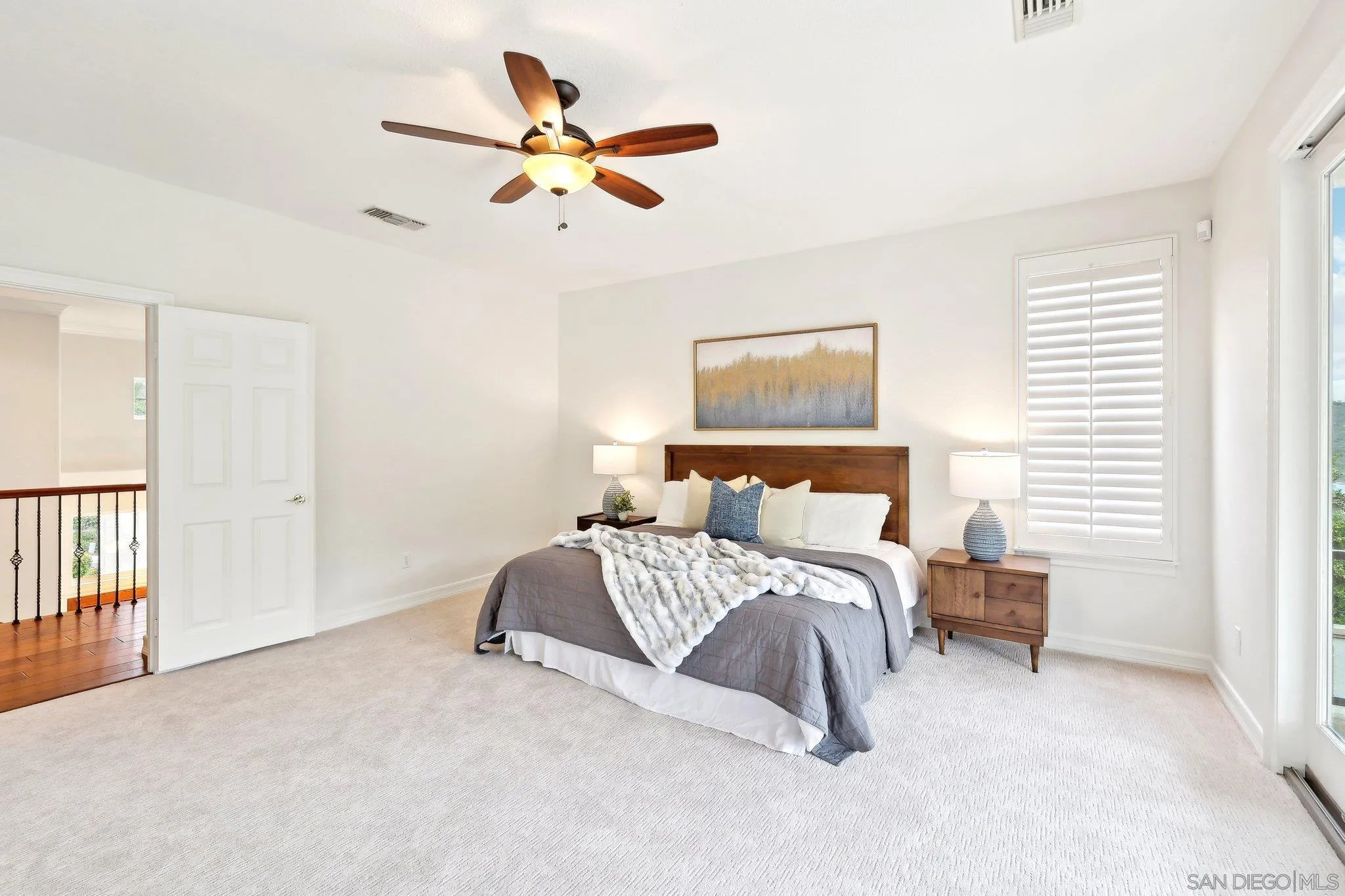 11781 Treadwell Drive Poway, CA 92064 - Photo 42 of 63 a bedroom with a bed and a ceiling fan