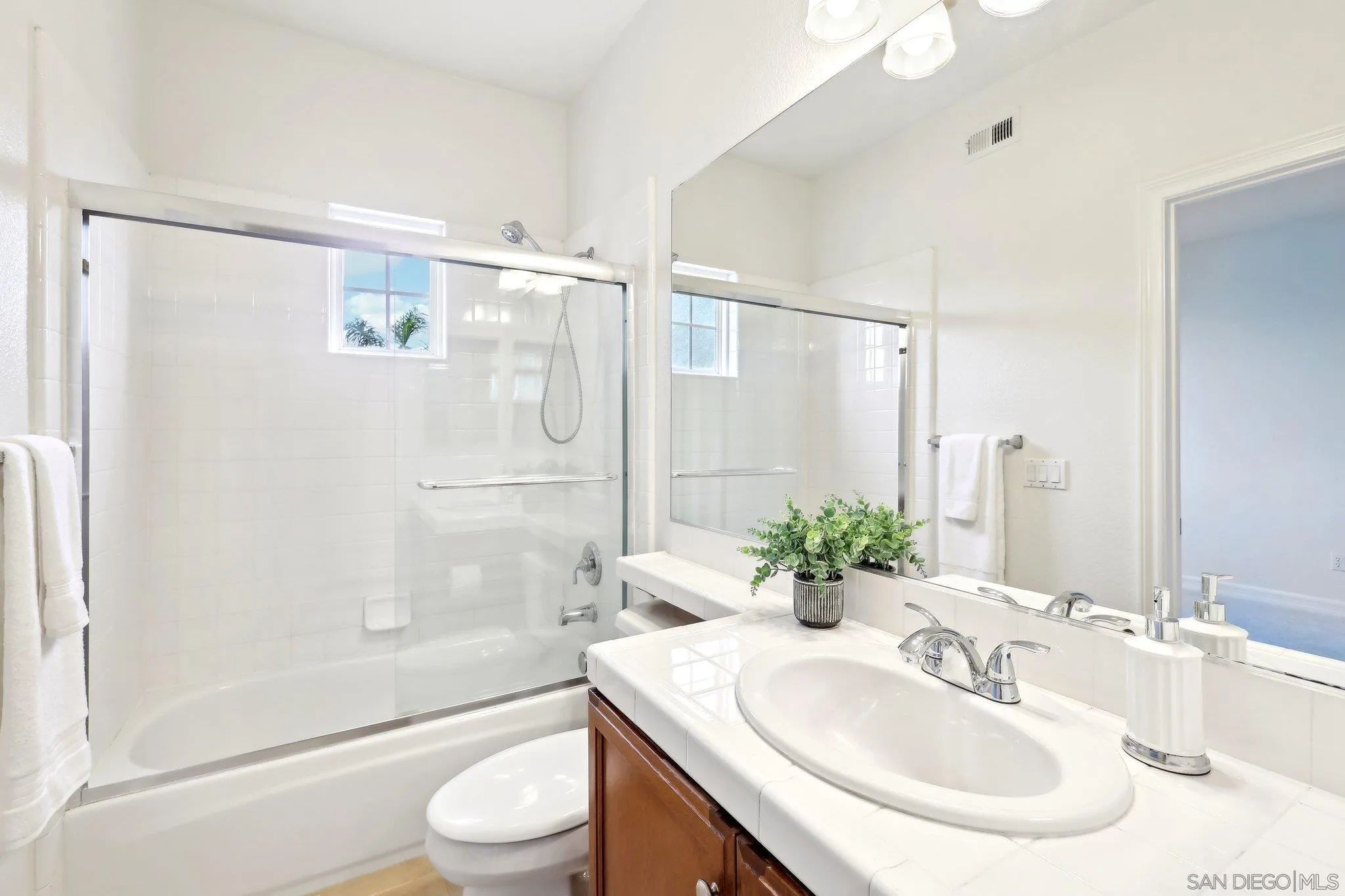 11781 Treadwell Drive Poway, CA 92064 - Photo 47 of 63 a bathroom with a sink toilet and shower