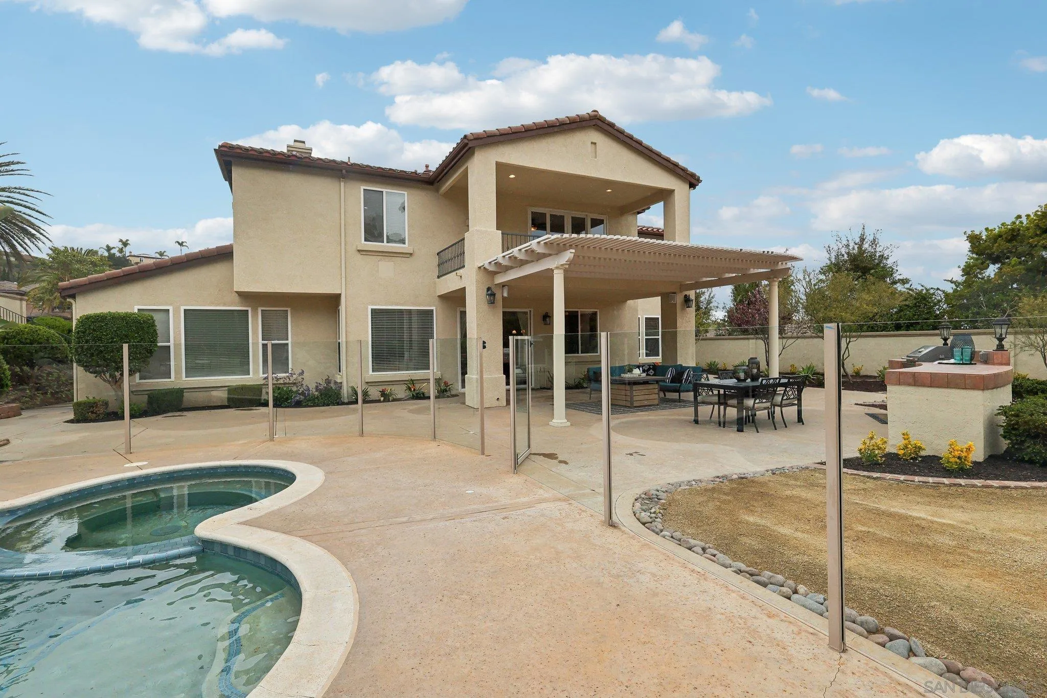 11781 Treadwell Drive Poway, CA 92064 - Photo 57 of 63 a view of a patio with a table and chairs