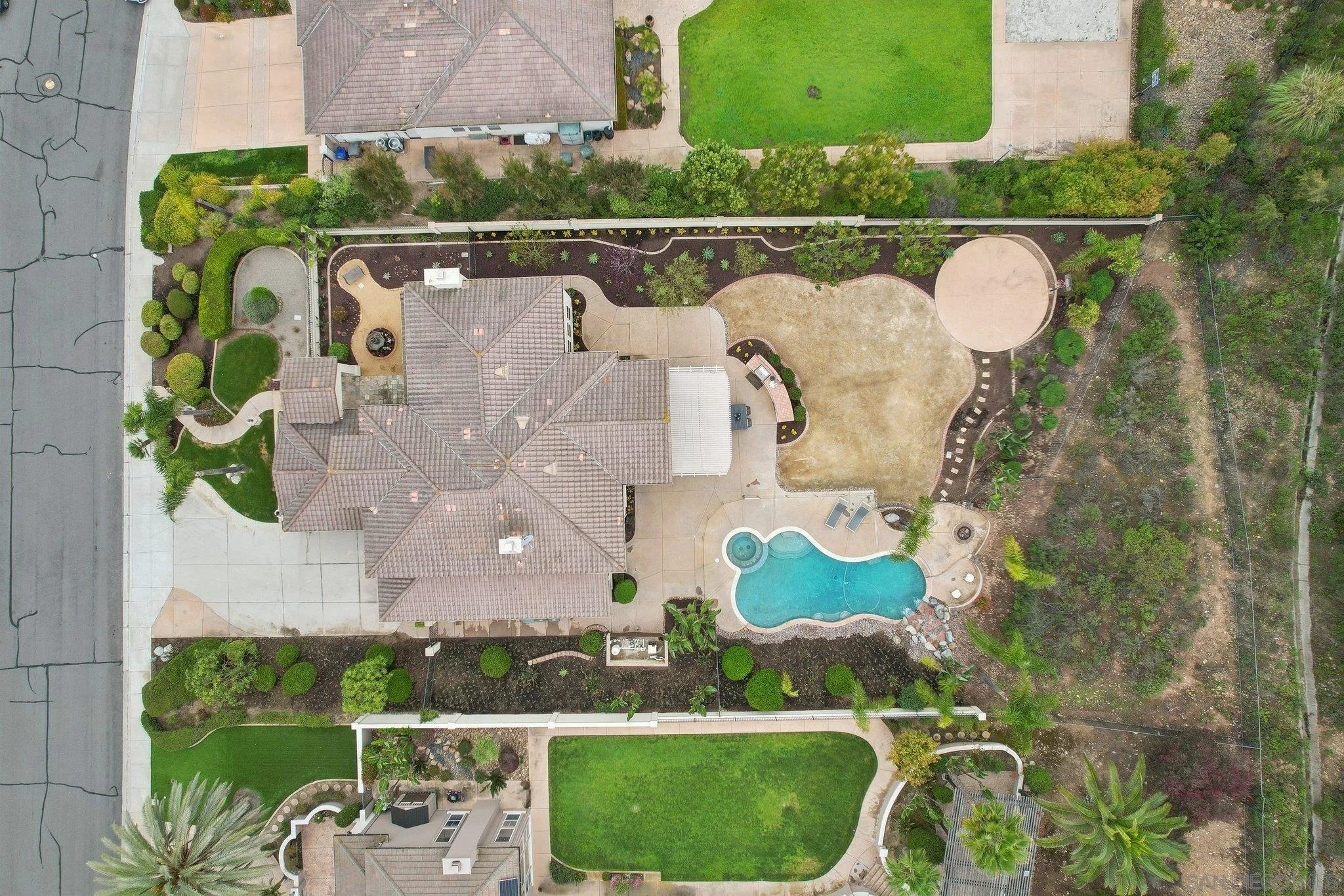 11781 Treadwell Drive Poway, CA 92064 - Photo 61 of 63 an aerial view of a house with a garden and a swimming pool