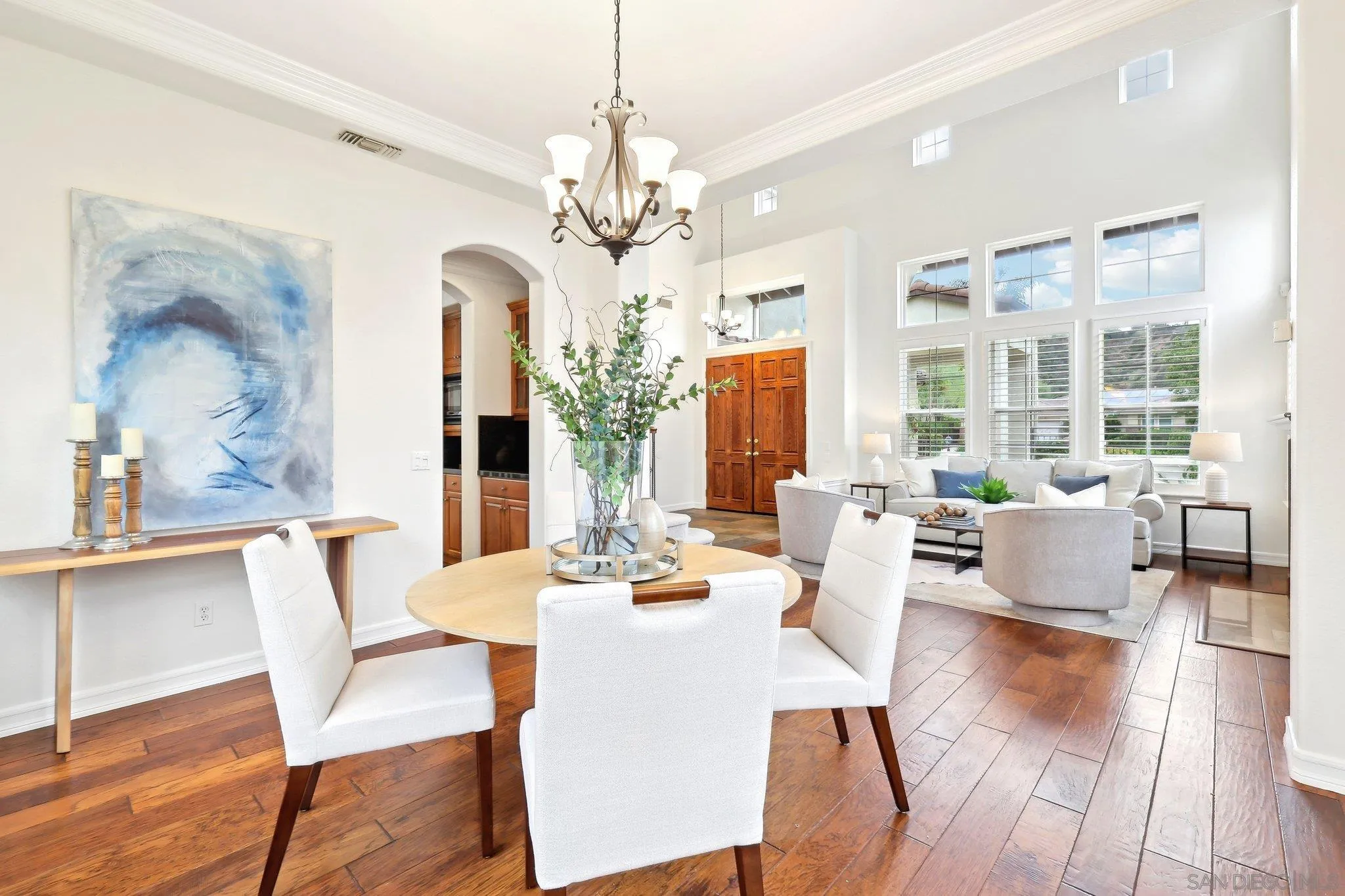 11781 Treadwell Drive Poway, CA 92064 - Photo 7 of 63 a view of a dining room with furniture wooden floor and chandelier