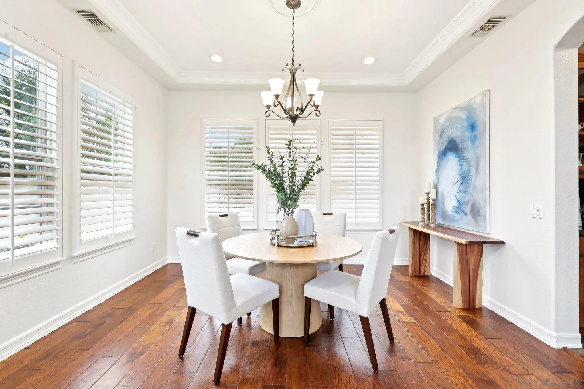 11781 Treadwell Drive Poway, CA 92064 - Photo 8 of 63 a view of a dining room with furniture wooden floor and chandelier
