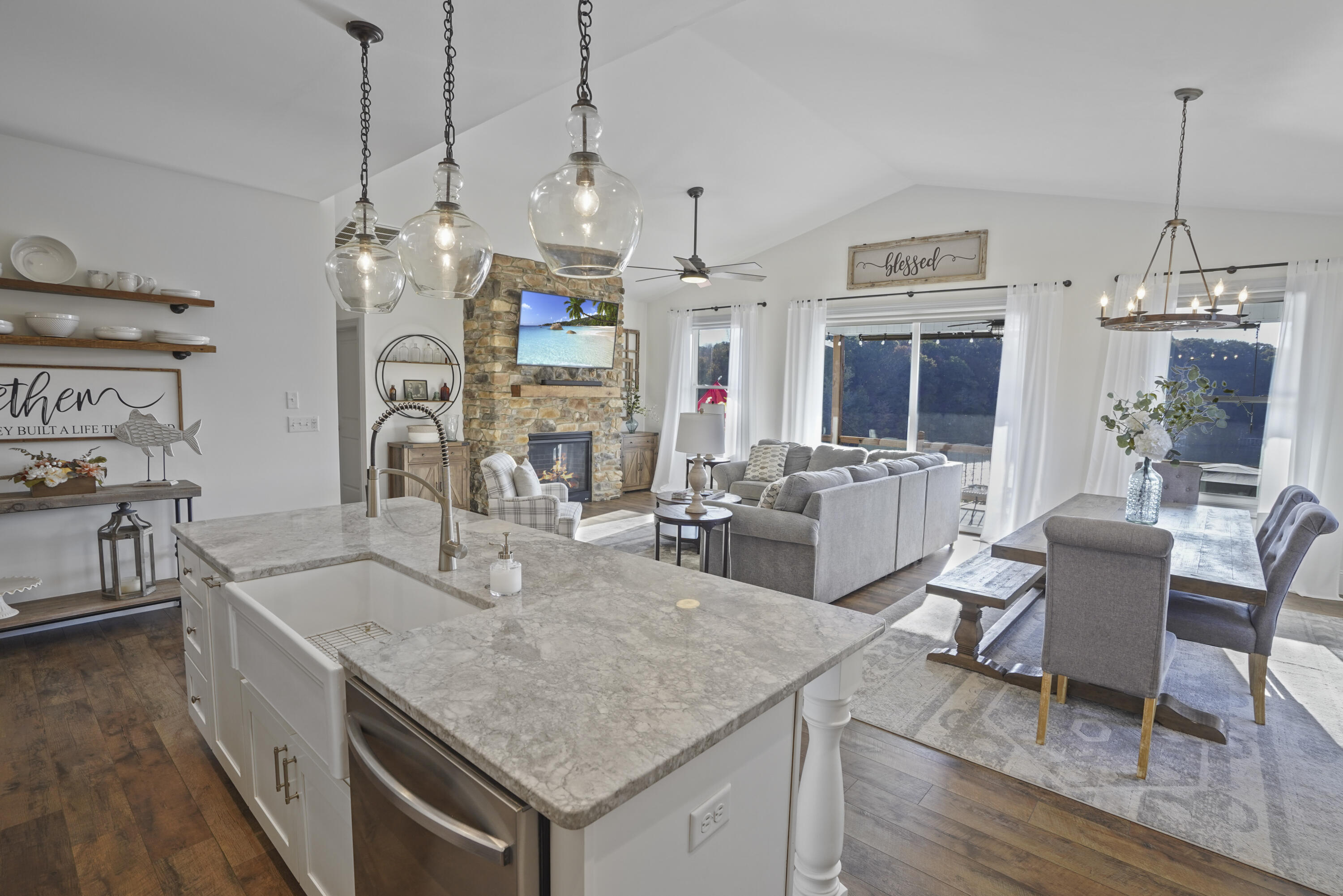 11 Old Point Road Moneta, VA 24121 - Photo 13 of 49 a kitchen with granite countertop a sink a counter space dining table and stainless steel appliances
