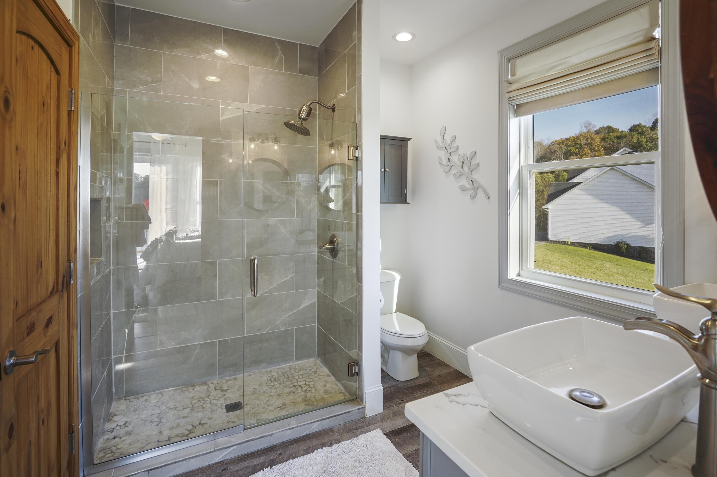 11 Old Point Road Moneta, VA 24121 - Photo 18 of 49 a bathroom with a bathtub shower sink mirror and toilet