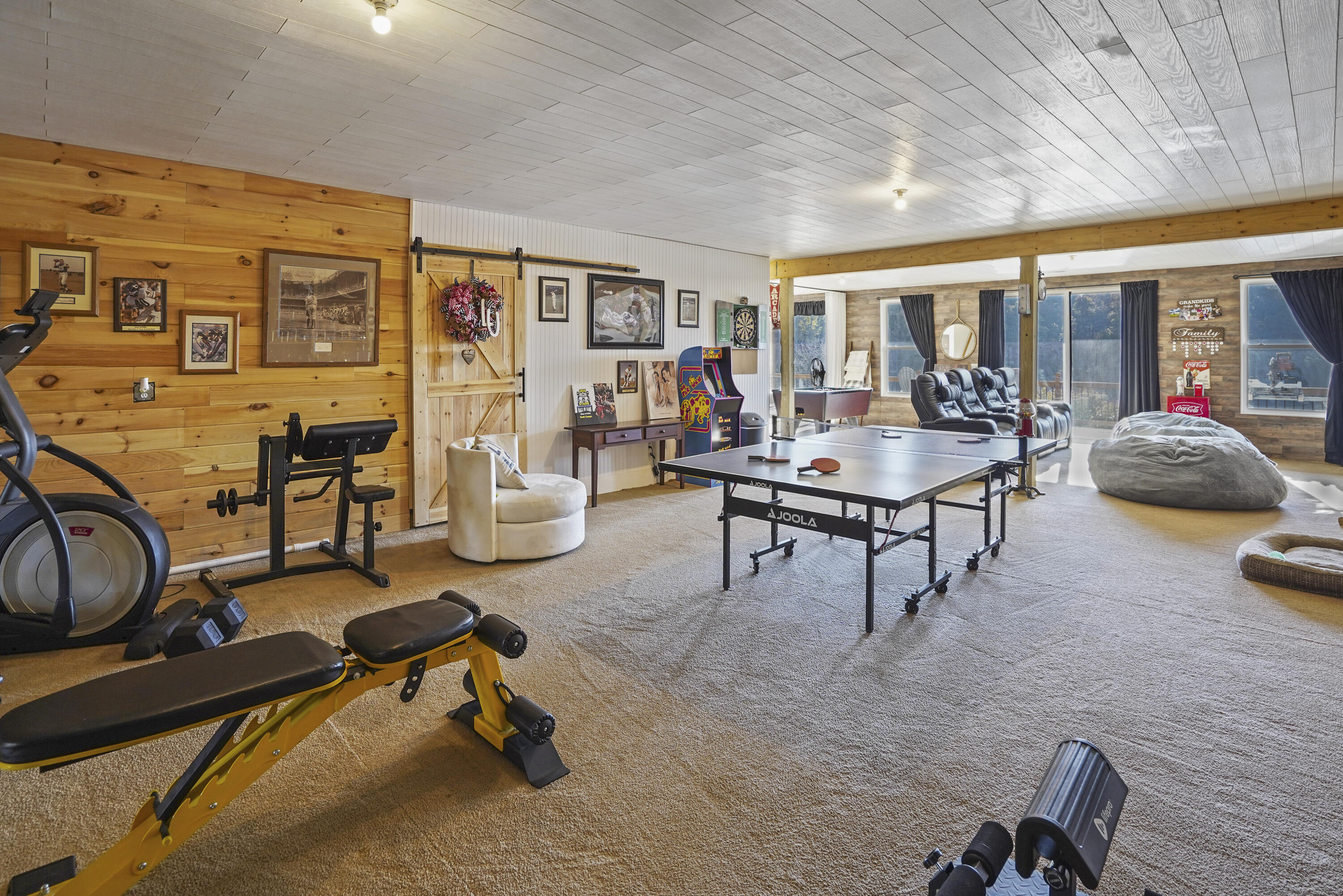 11 Old Point Road Moneta, VA 24121 - Photo 29 of 49 a living room with furniture gym equipment and large windows