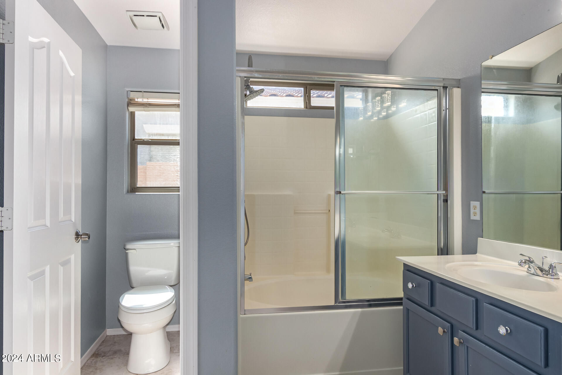 4333 South Rim Court Gilbert, AZ 85297 - Photo 12 of 77 a bathroom with a granite countertop sink toilet and shower