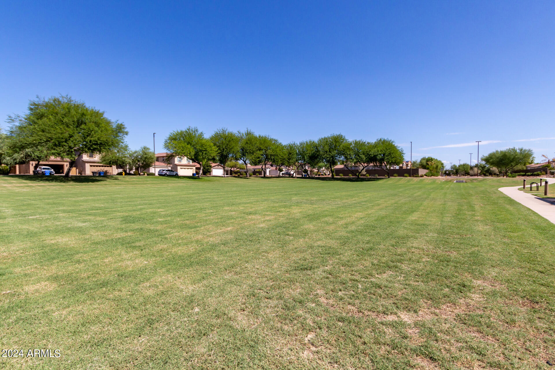 4333 South Rim Court Gilbert, AZ 85297 - Photo 32 of 77 a view of a lake with a house in the background