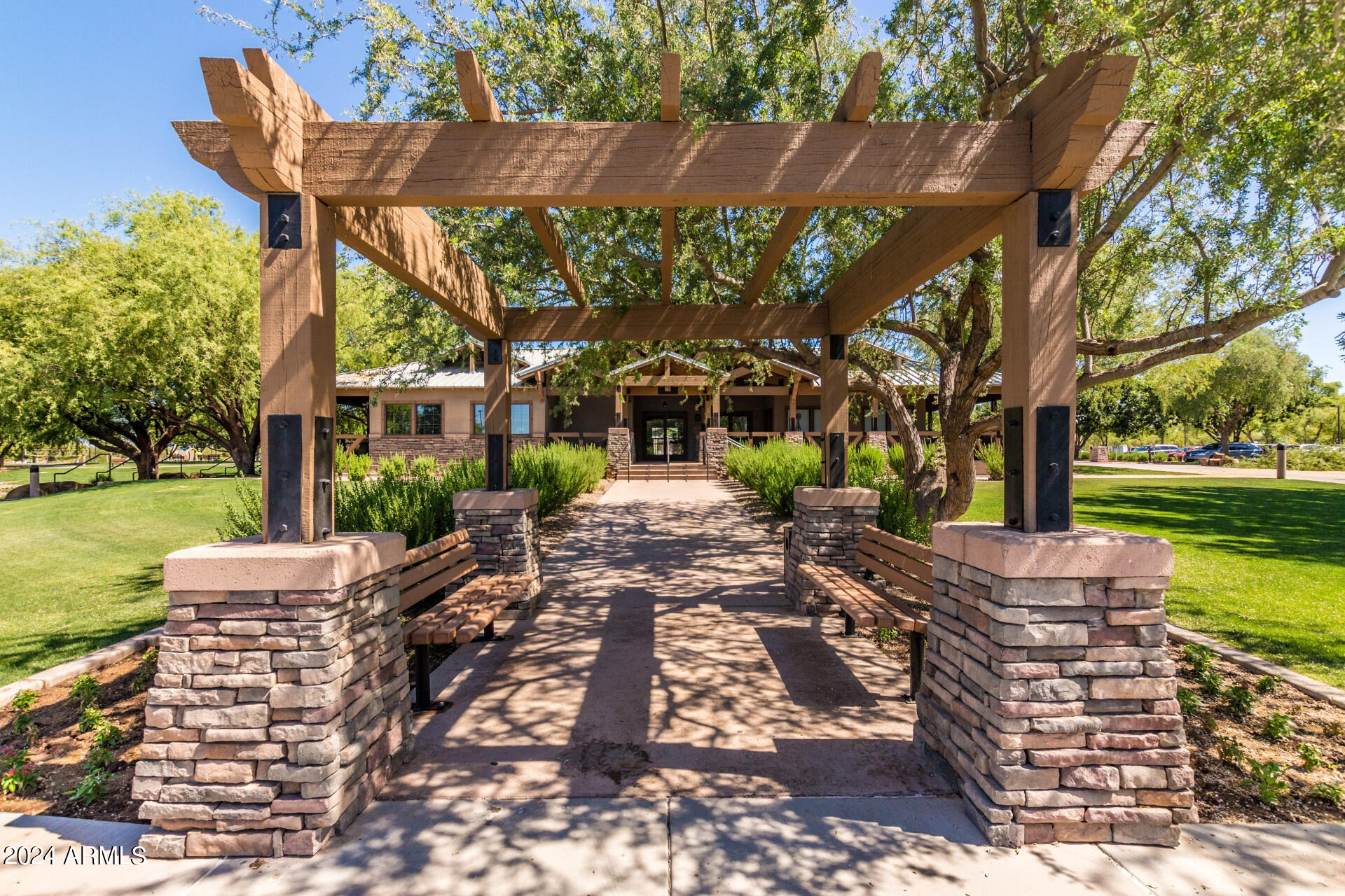 4333 South Rim Court Gilbert, AZ 85297 - Photo 71 of 77 a view of a patio with table and chairs potted plants and a large tree