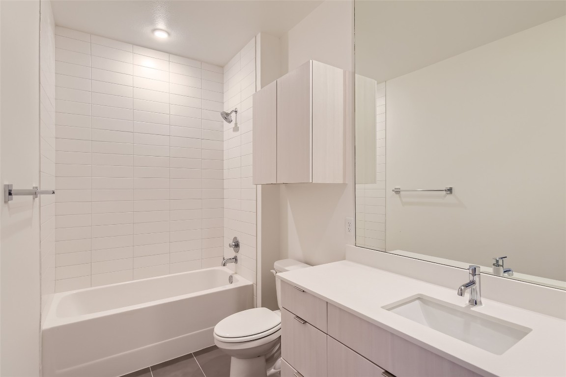 4802 South Congress Avenue, Unit 305 Austin, TX 78745 - Photo 13 of 25 a bathroom with a sink toilet and shower