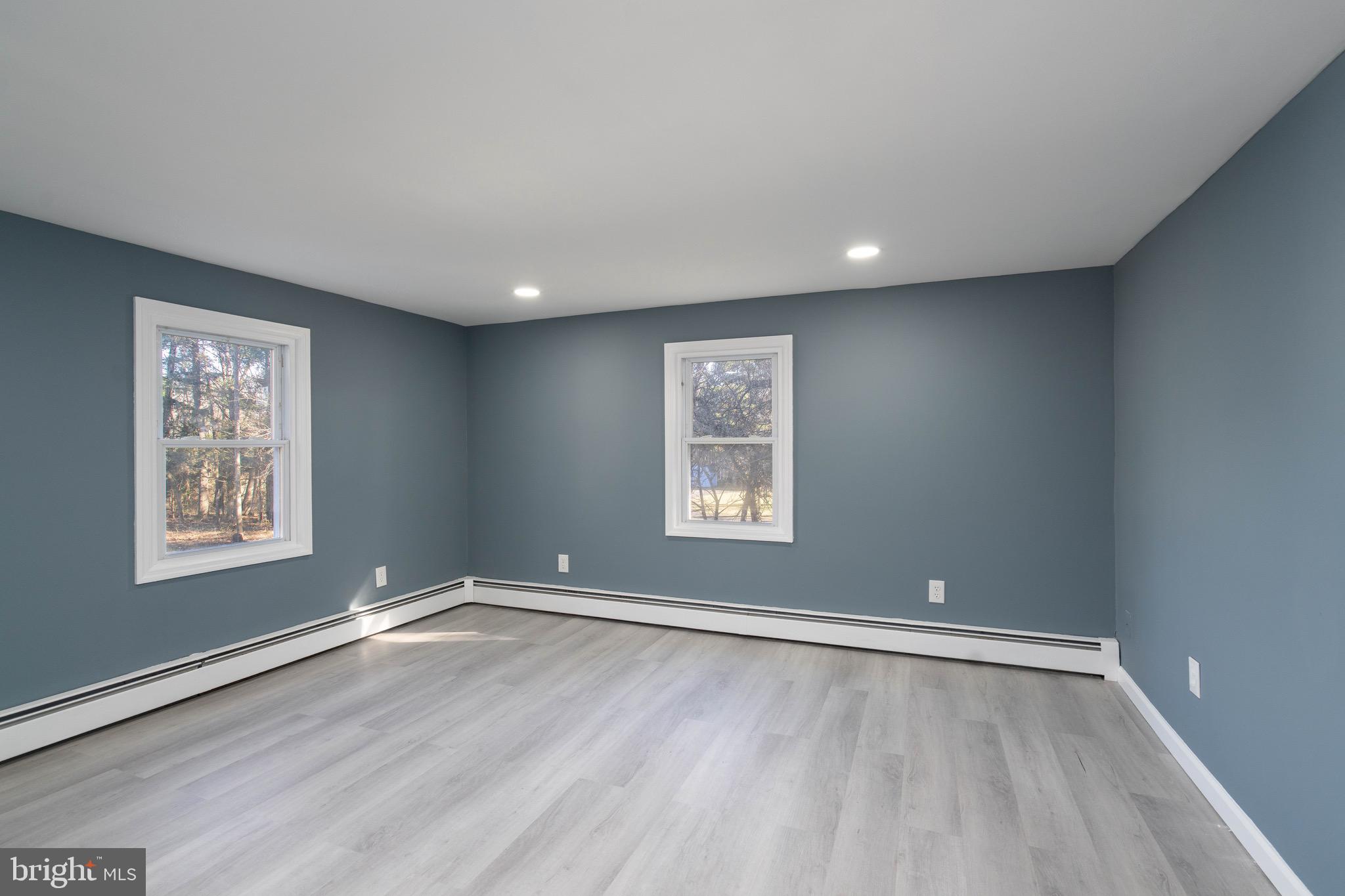 960 Carmel Road Millville, NJ 08332 - Photo 12 of 35 a view of a big room with wooden floor and windows
