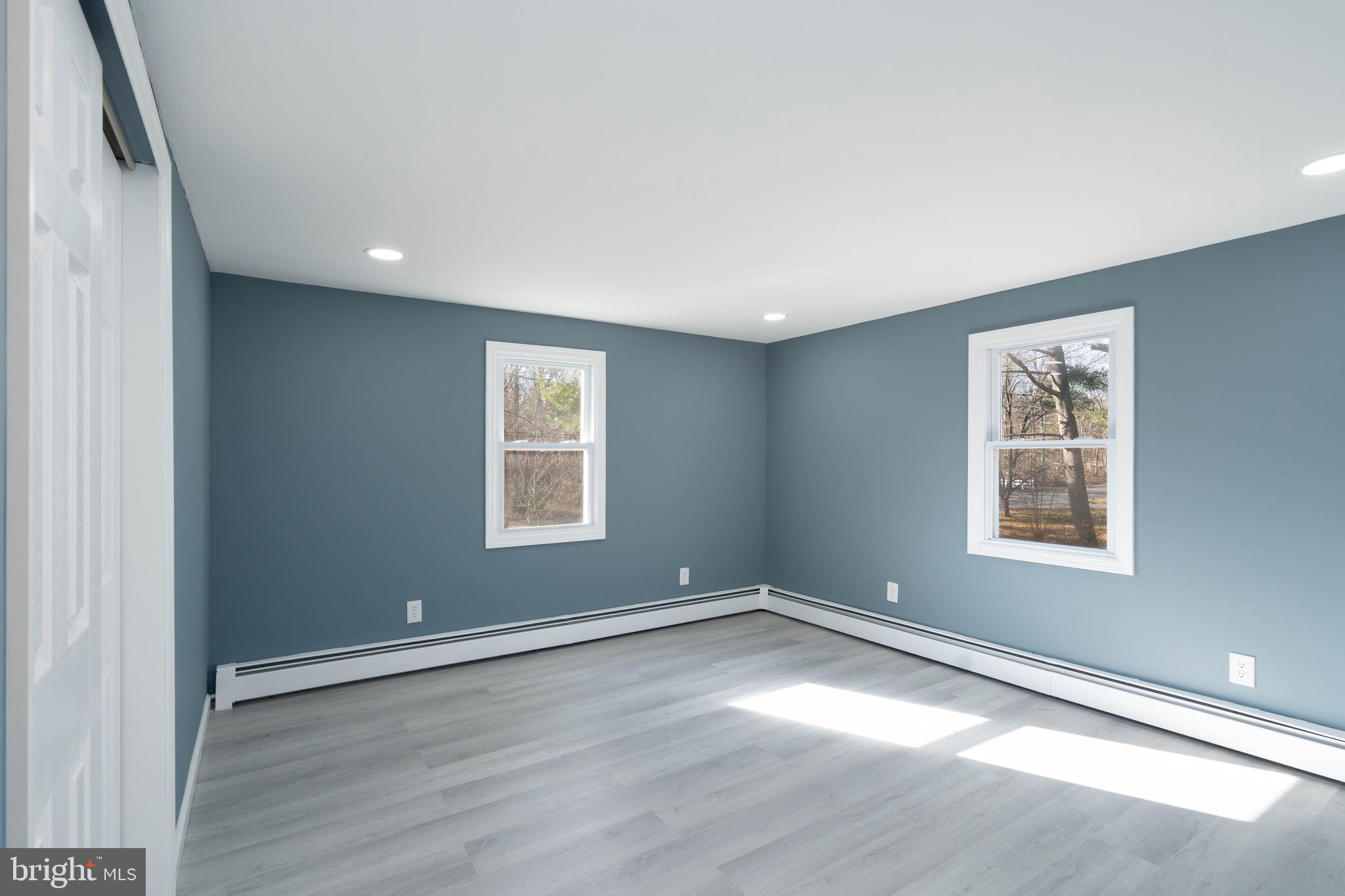 960 Carmel Road Millville, NJ 08332 - Photo 14 of 35 an empty room with wooden floor and windows