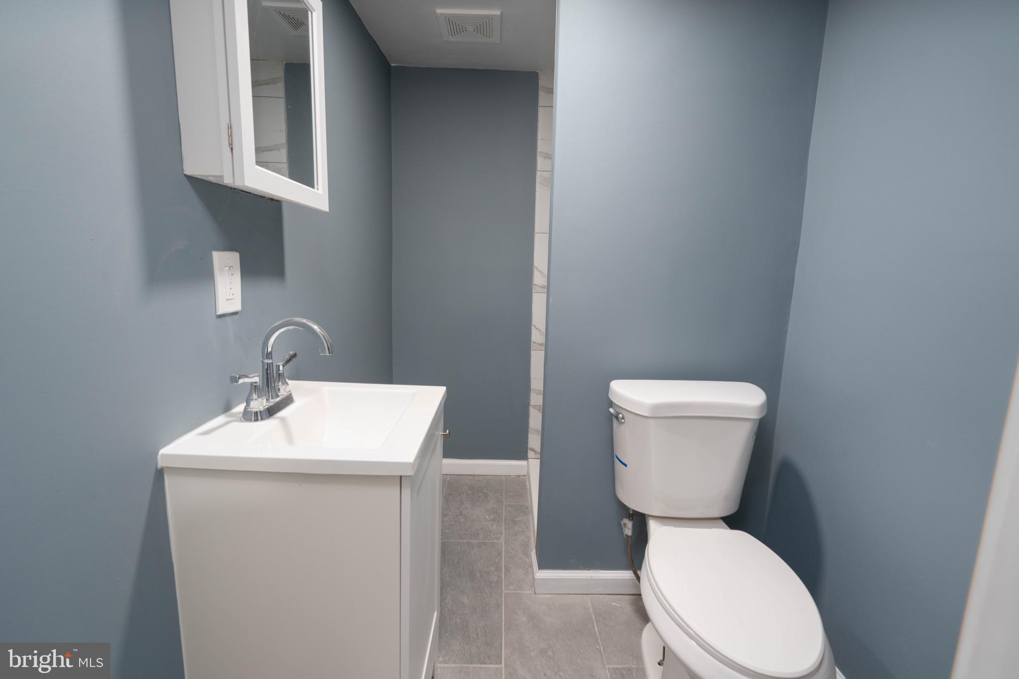 960 Carmel Road Millville, NJ 08332 - Photo 20 of 35 a white toilet sitting next to a white sink