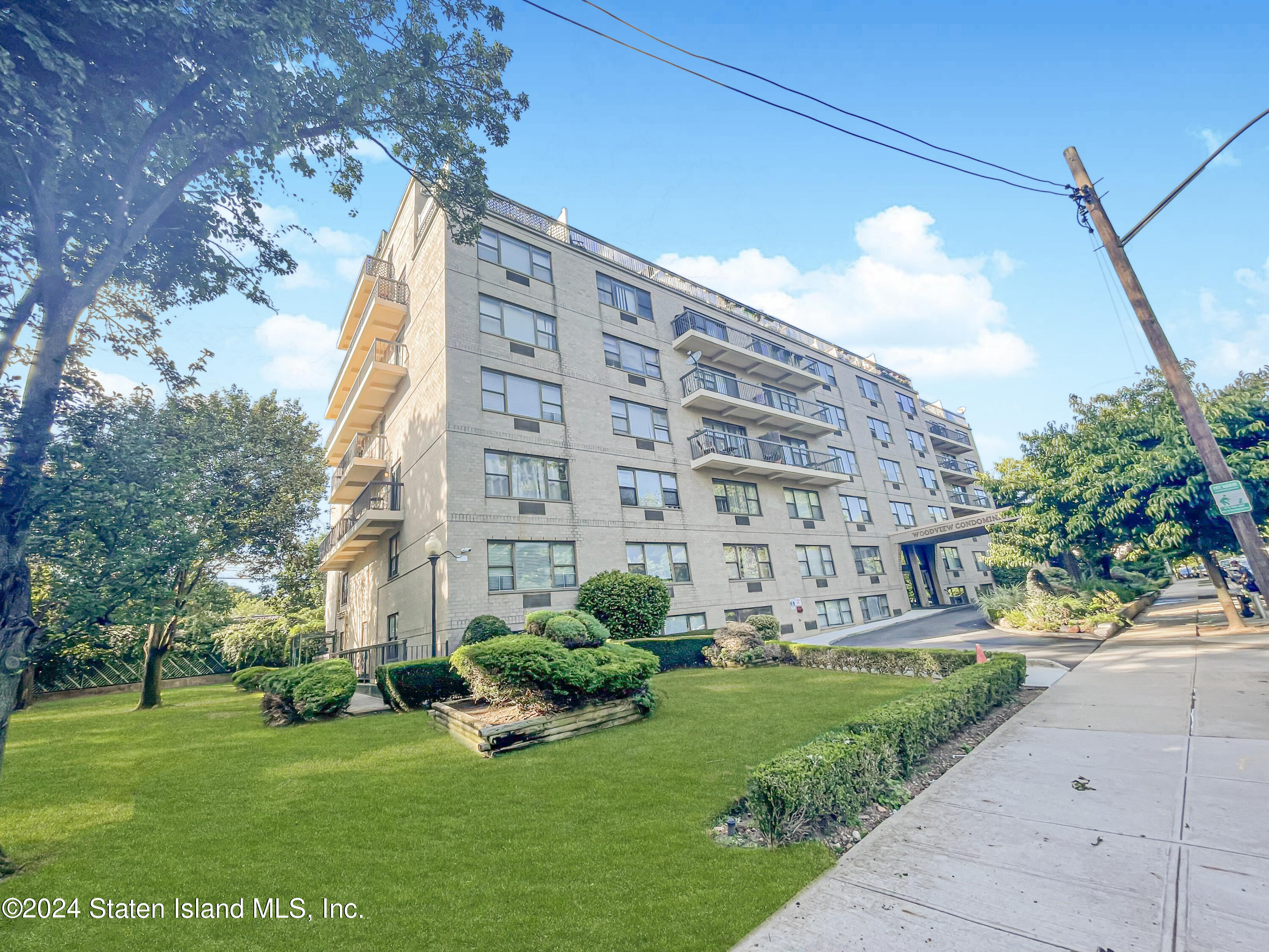 175 Zoe Street, Unit 5S Staten Island, NY 10305 - Photo 1 of 15 a view of a building with garden