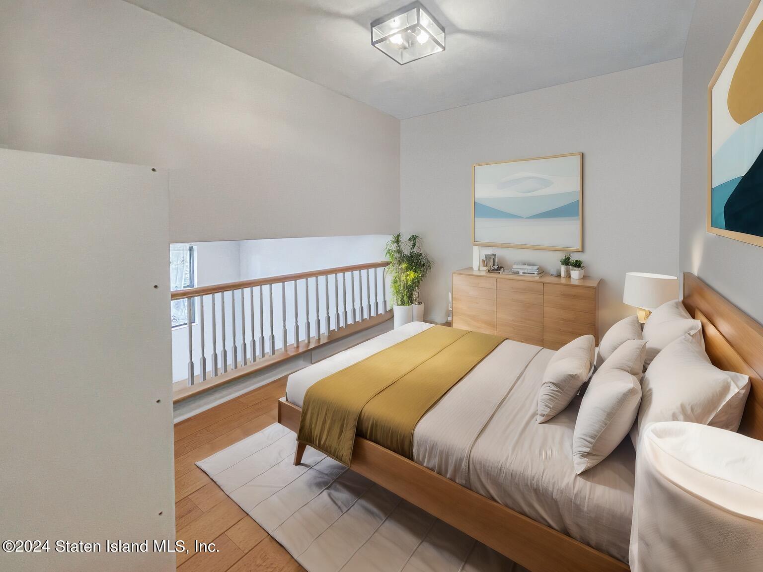 175 Zoe Street, Unit 5S Staten Island, NY 10305 - Photo 11 of 15 a bedroom with a bed and a window