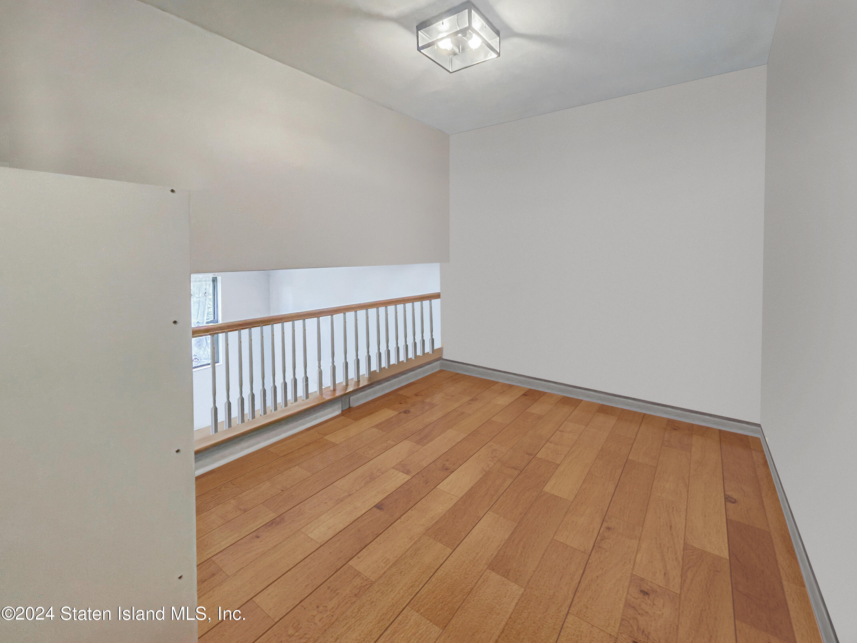 175 Zoe Street, Unit 5S Staten Island, NY 10305 - Photo 12 of 15 a view of a room with wooden floor