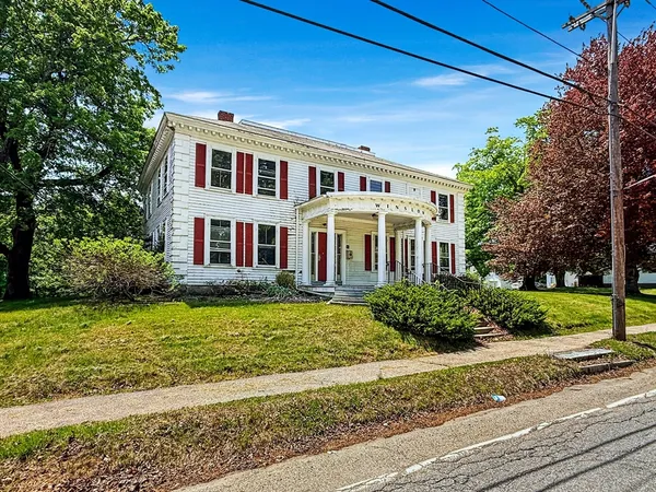 a front view of a house with a yard