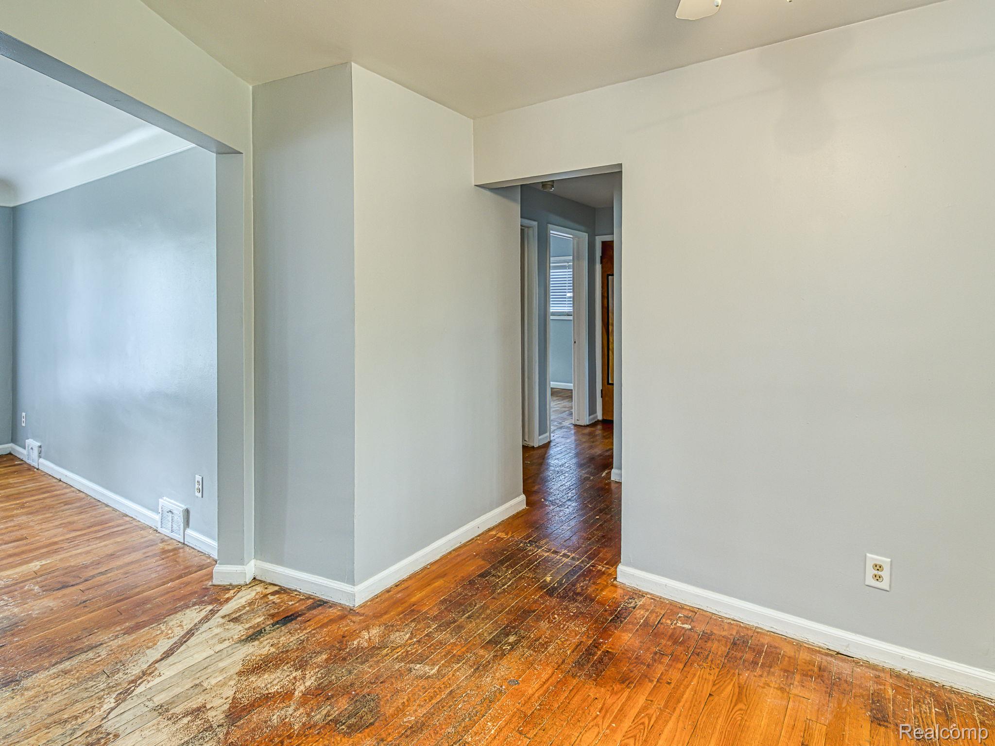 8501 Allen Road Allen Park, MI 48101 - Photo 7 of 27 Hallway featuring hardwood / wood-style floors and baseboards
