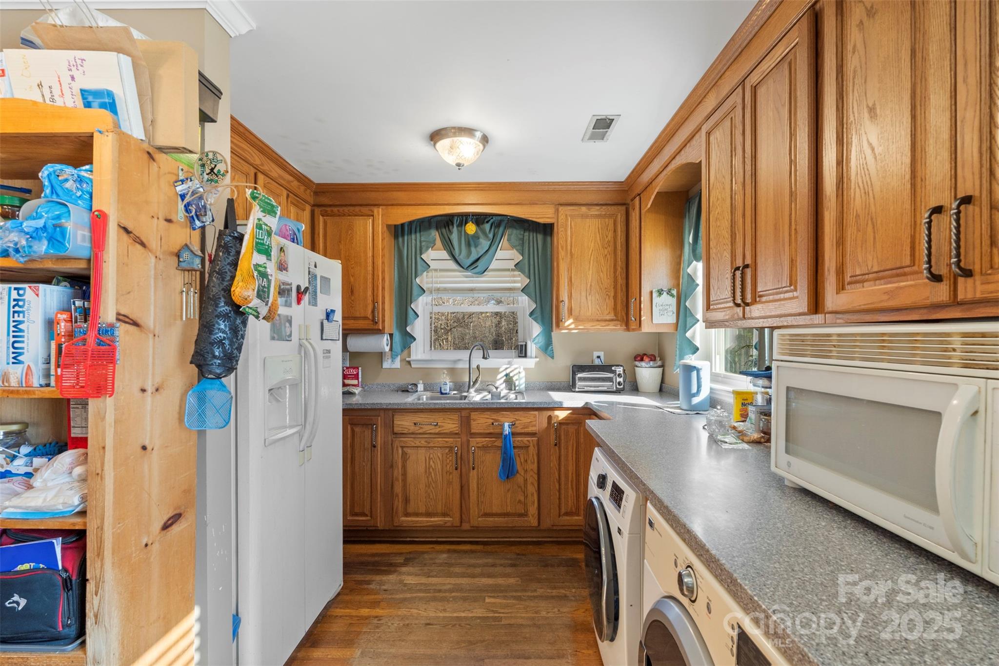 1580 Pine Ridge Road China Grove, NC 28023 - Photo 12 of 35 a kitchen with lots of counter top space and wooden floor