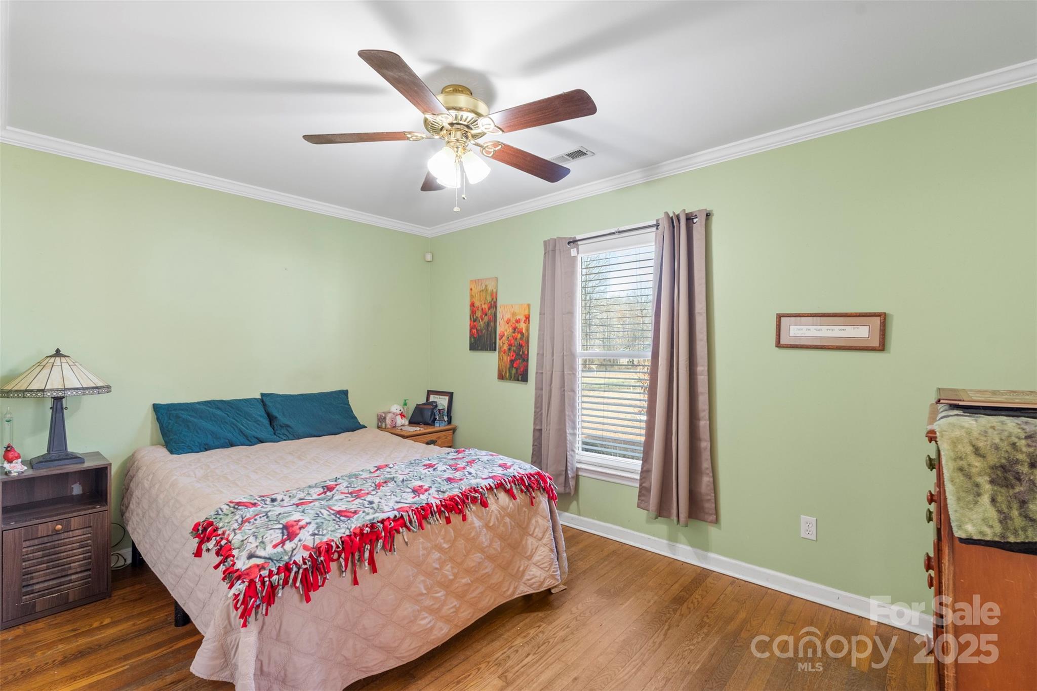 1580 Pine Ridge Road China Grove, NC 28023 - Photo 15 of 35 a bedroom with a bed and a chandelier