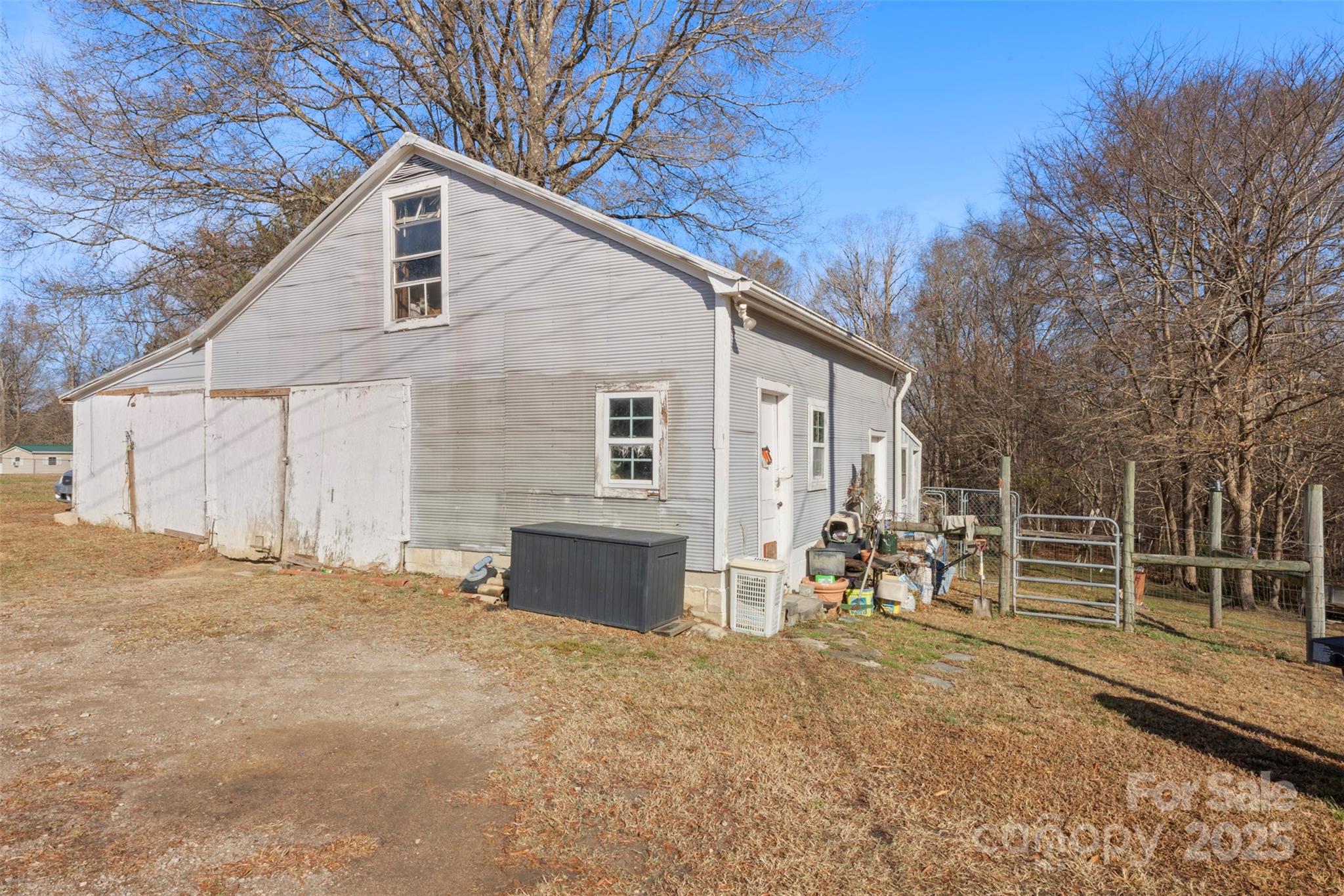 1580 Pine Ridge Road China Grove, NC 28023 - Photo 21 of 35 a front view of a house with a yard and garage