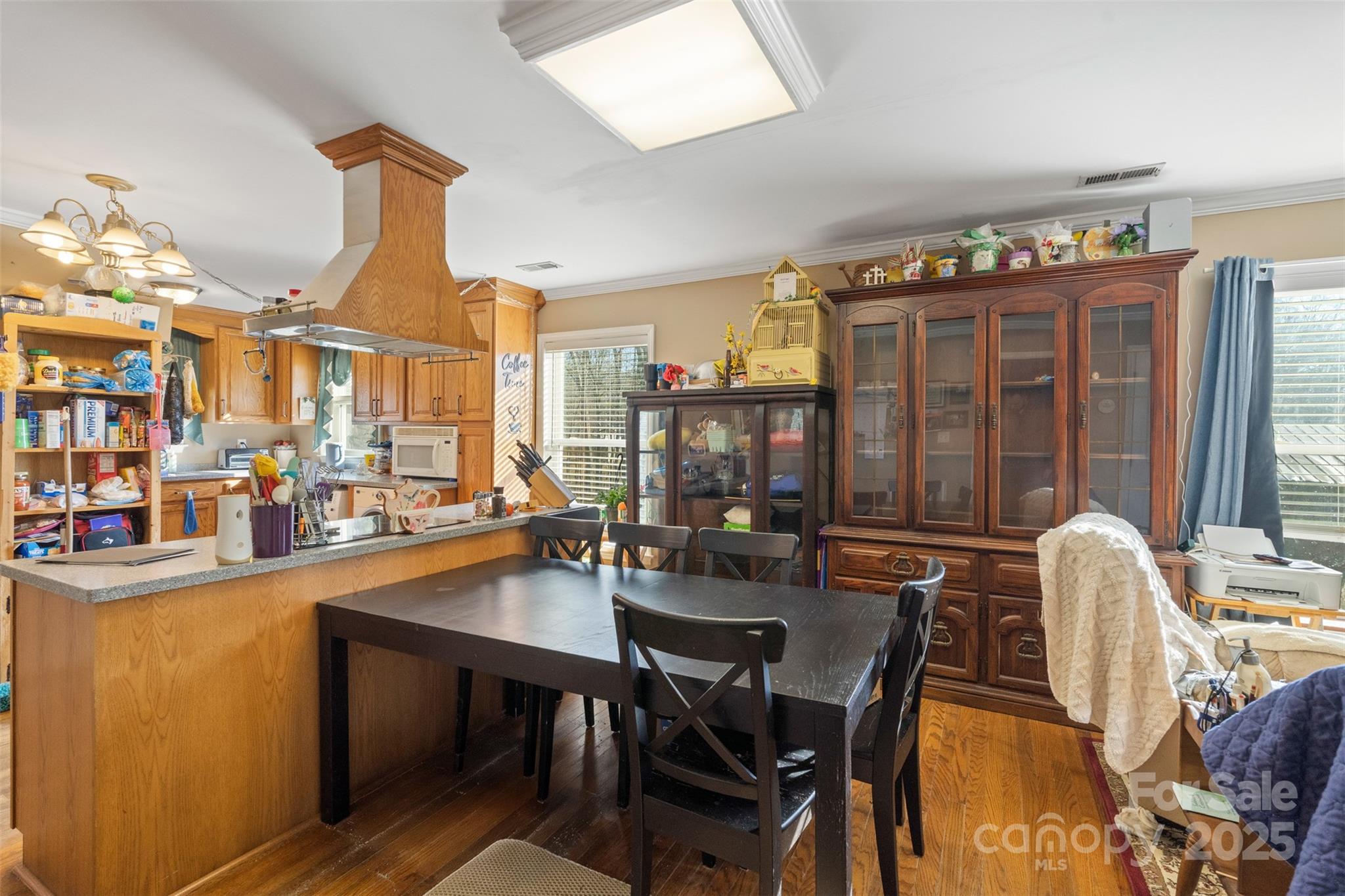1580 Pine Ridge Road China Grove, NC 28023 - Photo 9 of 35 a dining room with furniture a chandelier and wooden floor