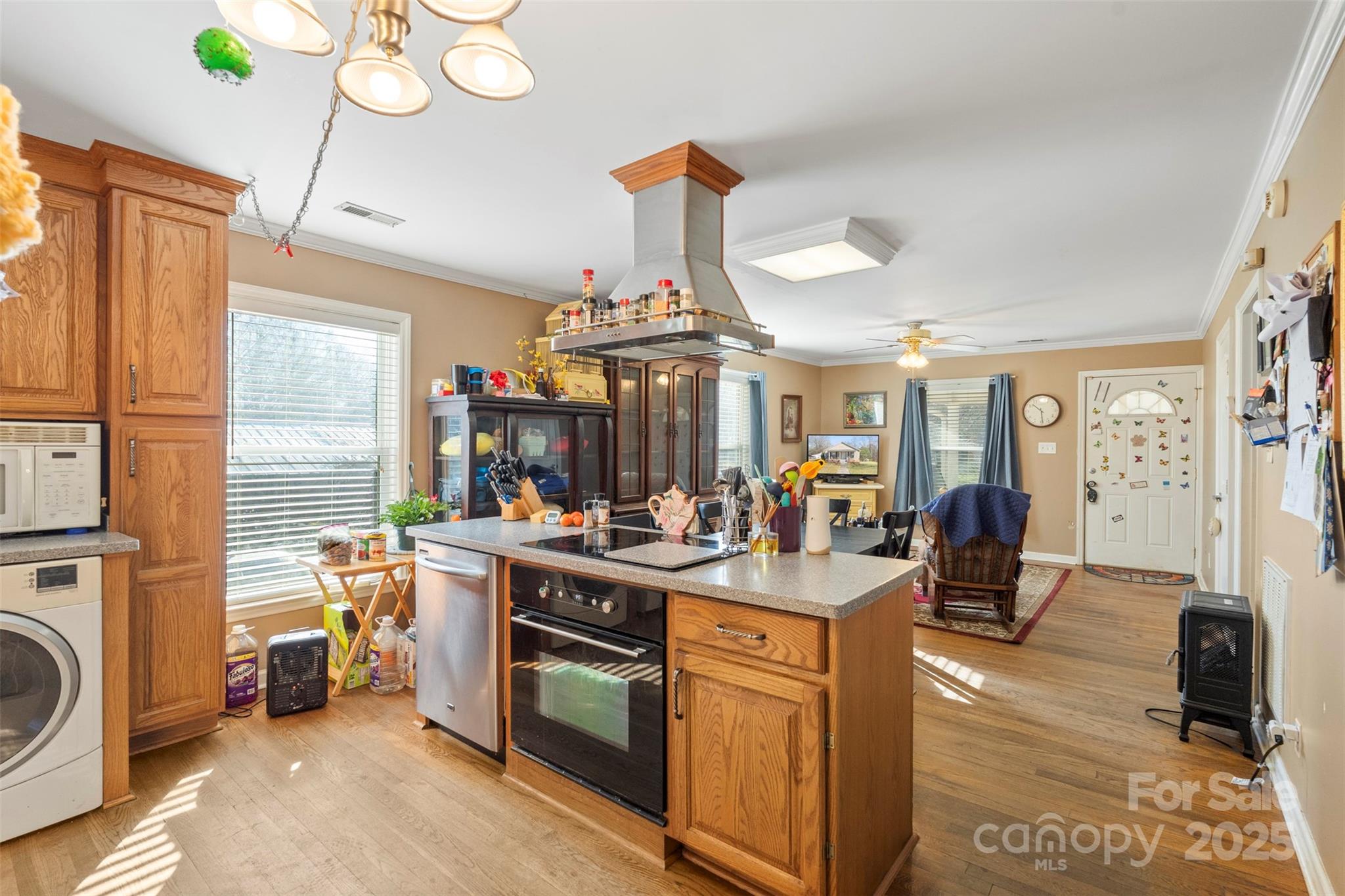 1580 Pine Ridge Road China Grove, NC 28023 - Photo 10 of 35 a view of a kitchen and dining area with chandelier