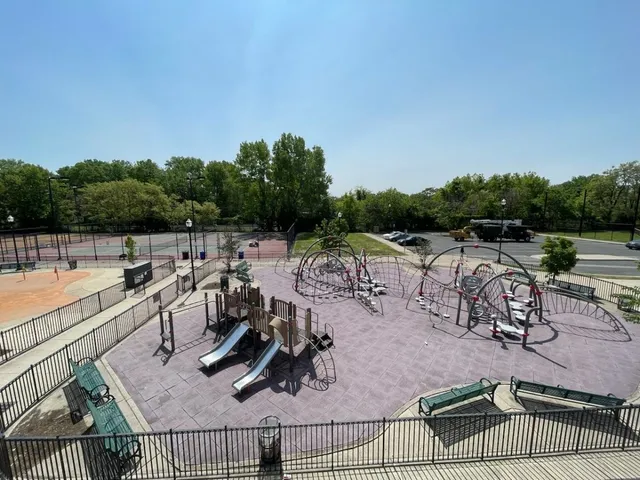 a view of a swimming pool with outdoor seating and plants